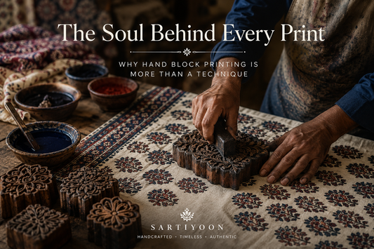 Artisan creating hand block printed fabric with a carved wooden block, showcasing the craftsmanship and tradition behind hand block printing.