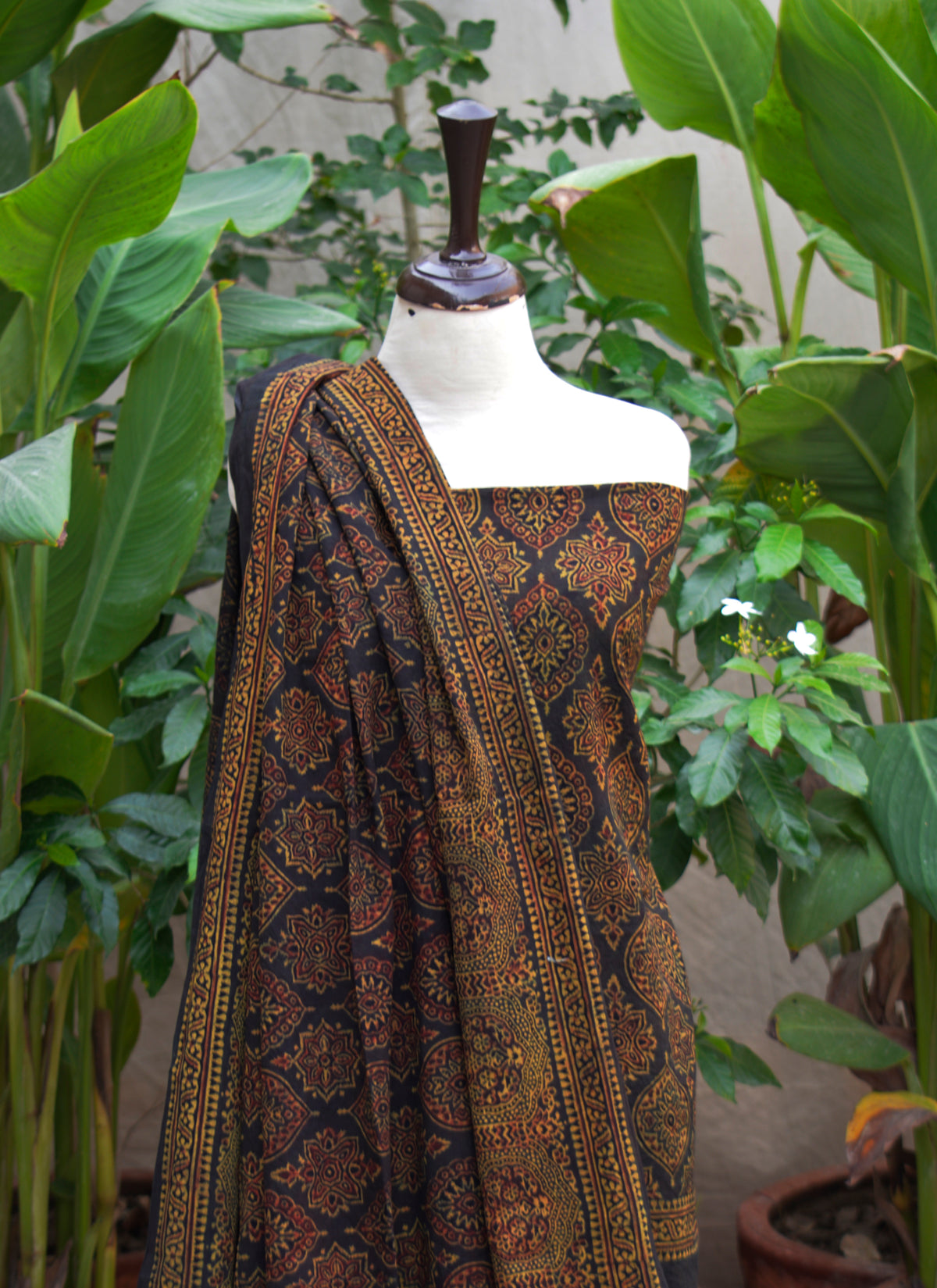 Unstitched two-piece Ajrak design dress dark green with maroon motifs in lawn or cotton 2.5m x 44