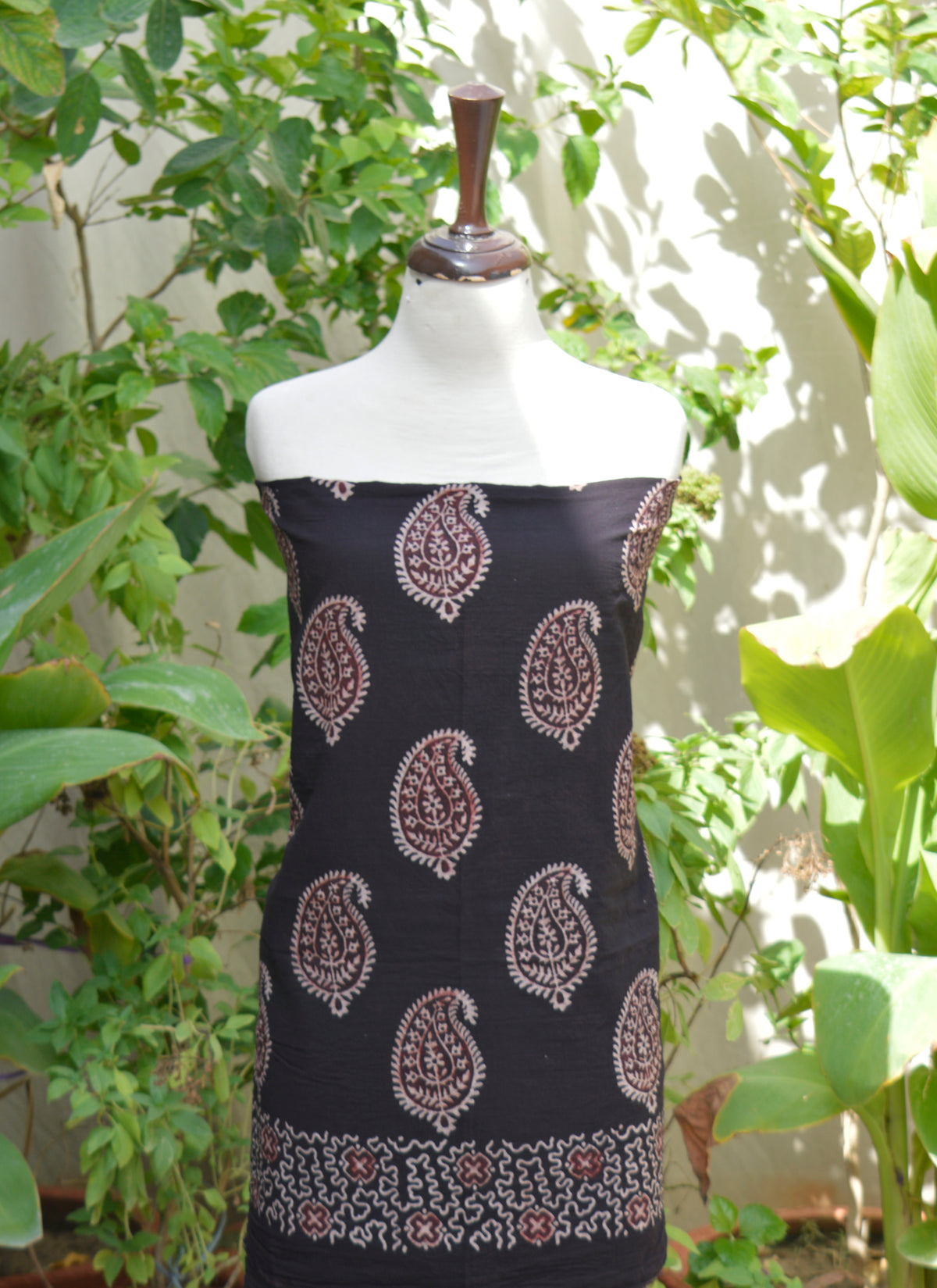 Unstitched black Ajrak outfit featuring traditional Anbi Kakkar design in natural dye