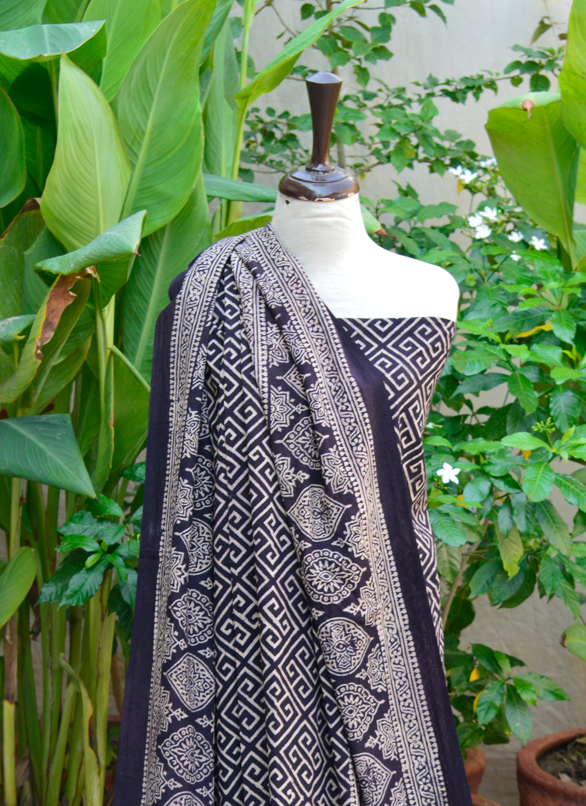 Traditional Ajrak Taskeen motif in black – unstitched cotton two-piece dress set.