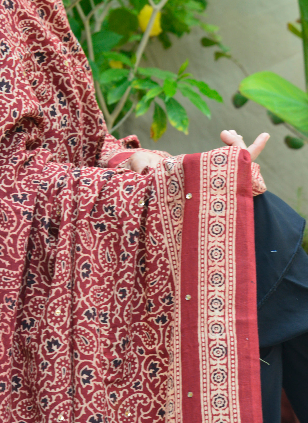 Red Ajrak design chaadar crafted with organic dyes, Chinar Leaf pattern, and artisanal tassels.