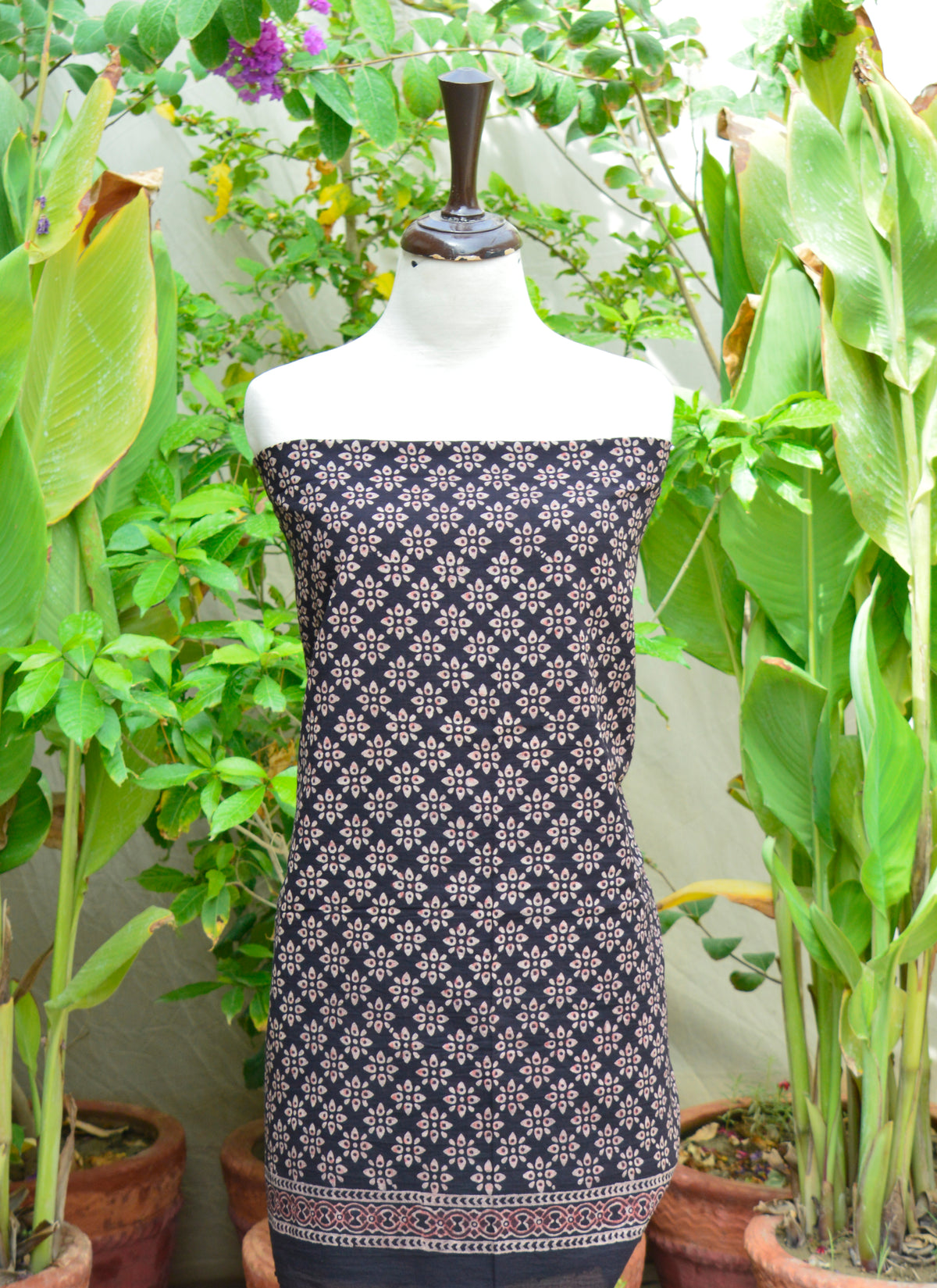 Organic dye Ajrak shirt and dupatta set in elegant black floral print, blending heritage with modern fashion.