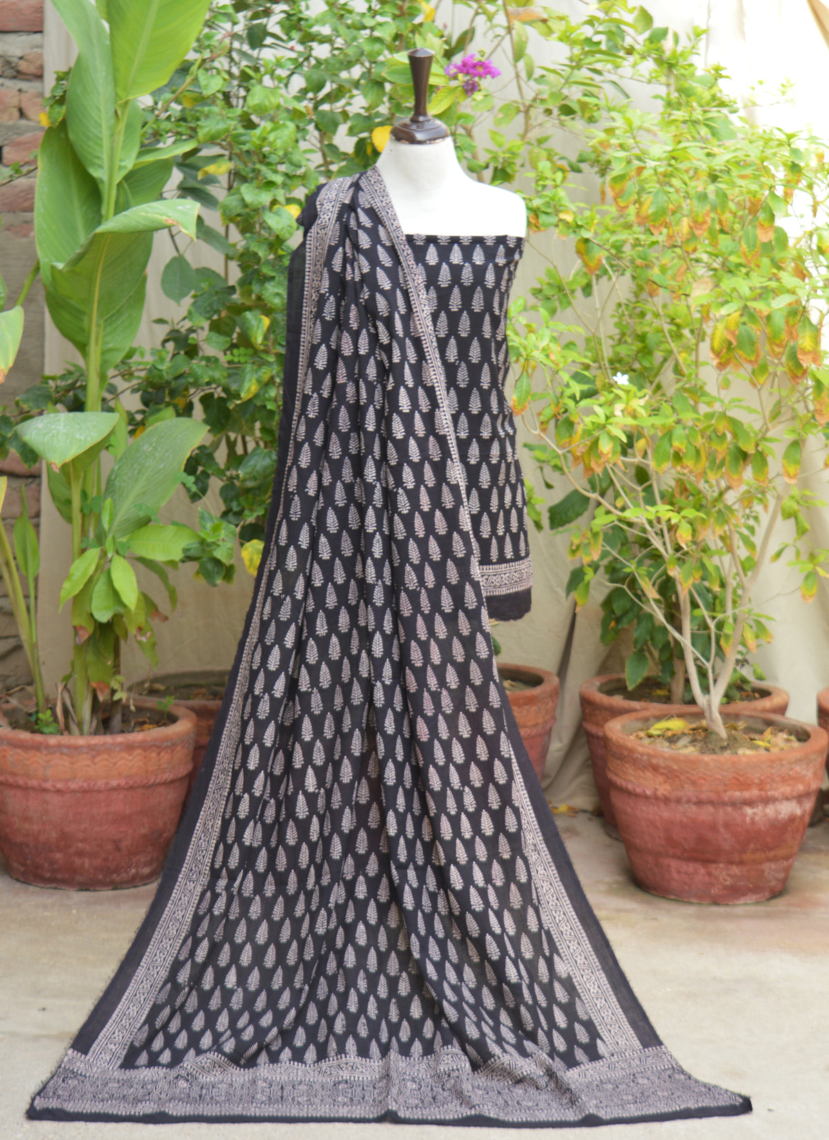 Traditional Sindhi Ajrak Black Mountain Butta dress in premium lawn fabric with breathable texture and handcrafted elegance