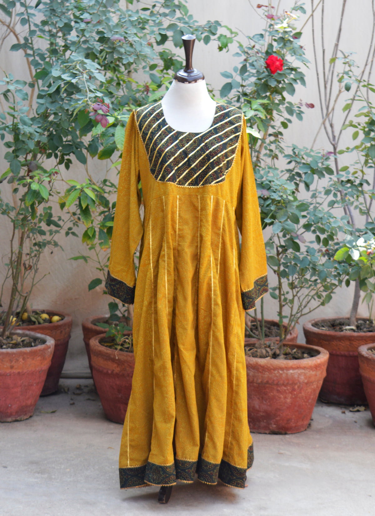 Handcrafted Ajrak mustard long Anarkali with green contrast sleeves and ghera design