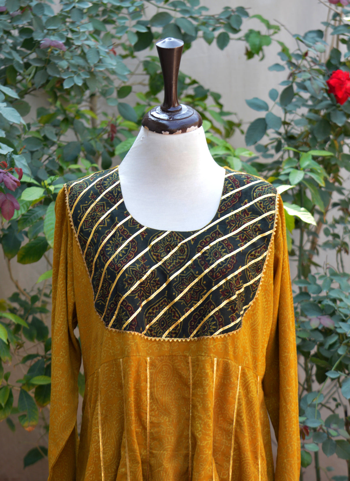 Luxury mustard Ajrak Anarkali festive dress with traditional detailing and lace accents