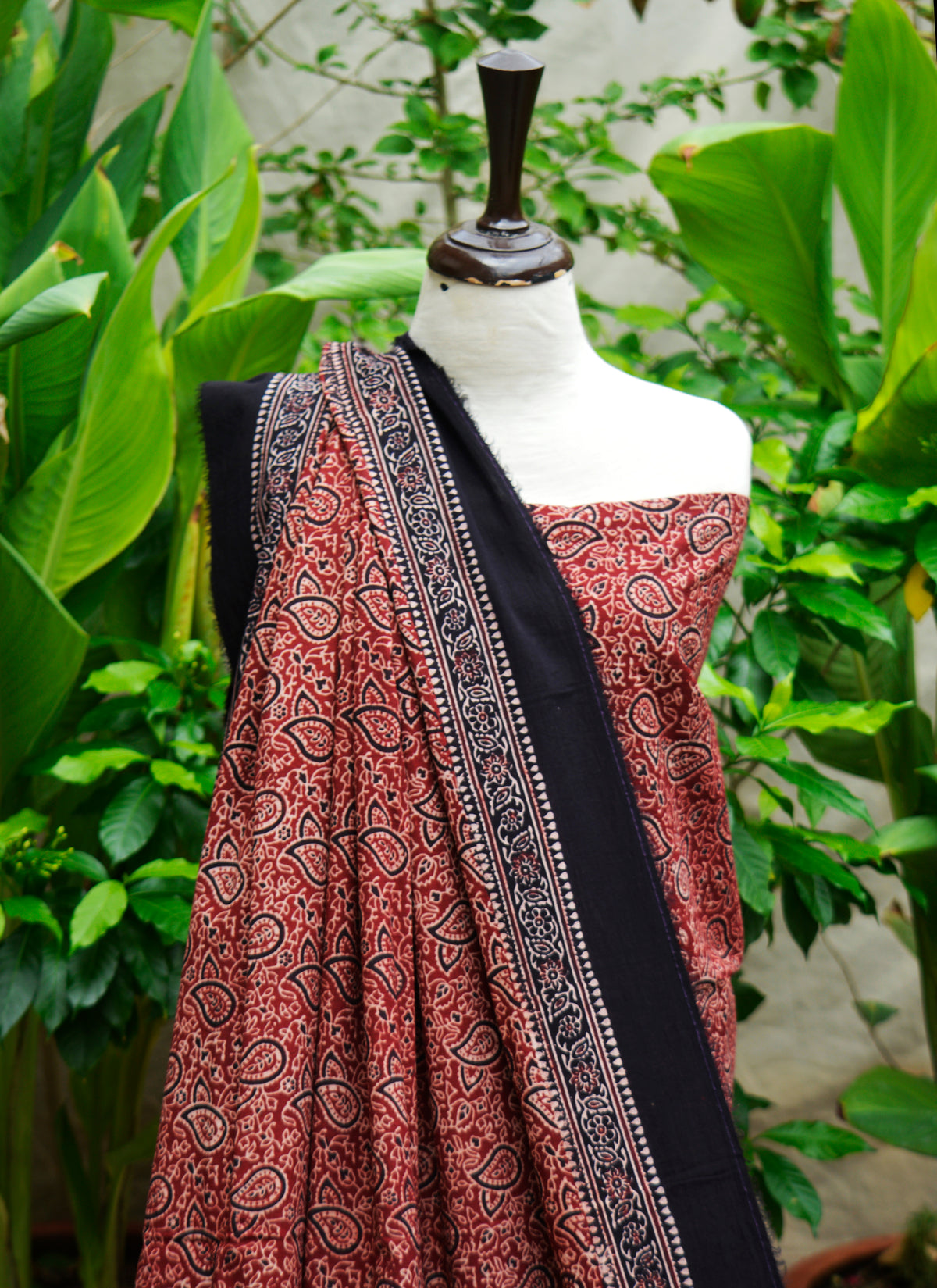 Close view of paisley bandana motifs on Ajrak Design Dress lawn fabric, Sindhi hand block printed pattern.