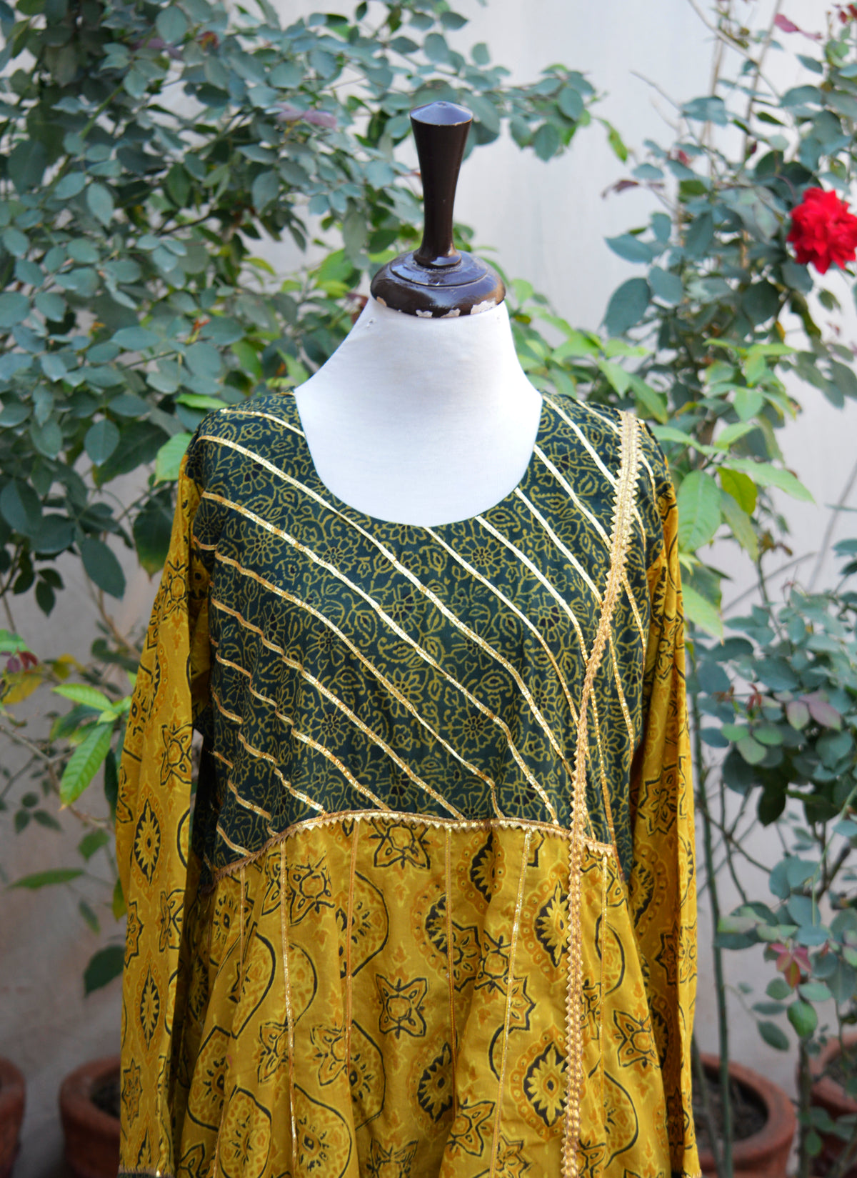 Premium mustard Ajrak Anarkali with green Bdam detailing and gotta lace