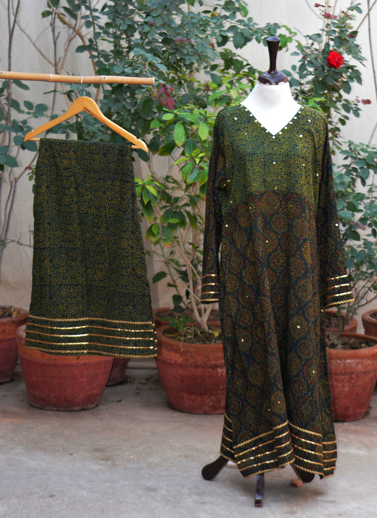 Green stitched Ajrak dress with sitara sequences and gotta lace frock and plazo festive wear Pakistan