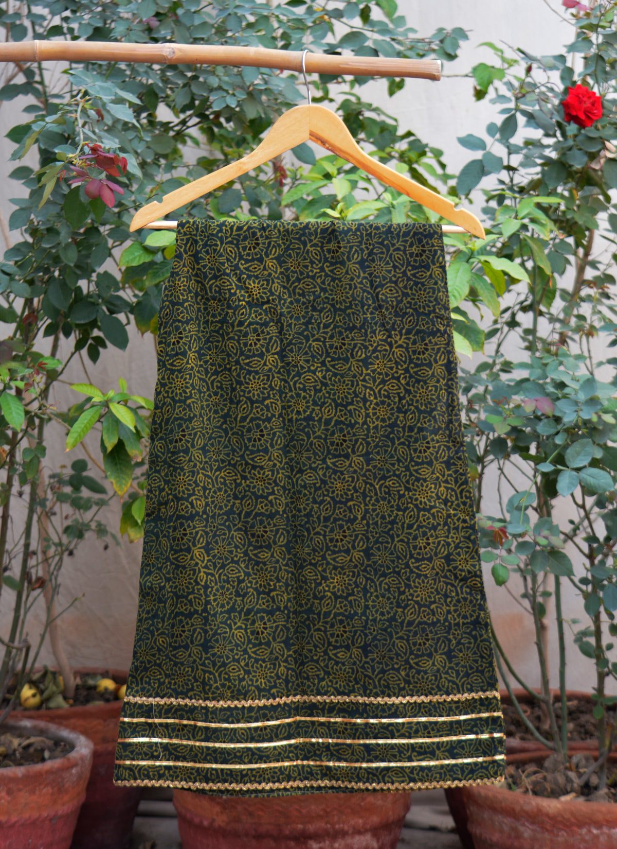 Handcrafted Ajrak green two piece stitched dress with sitara detailing and lace accents