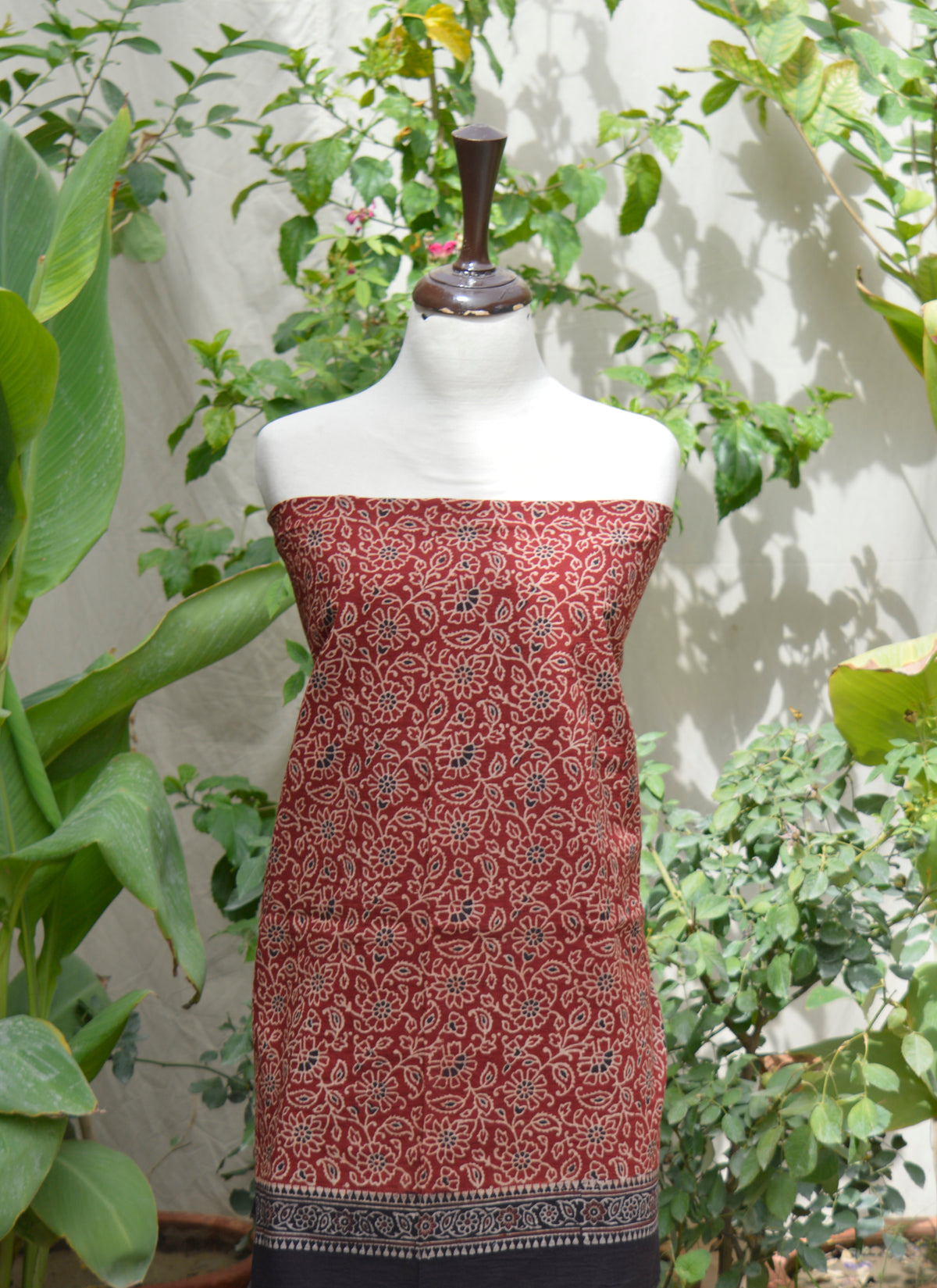 Eco-friendly Ajrak dress set with handcrafted red and black patterns using natural dye block printing