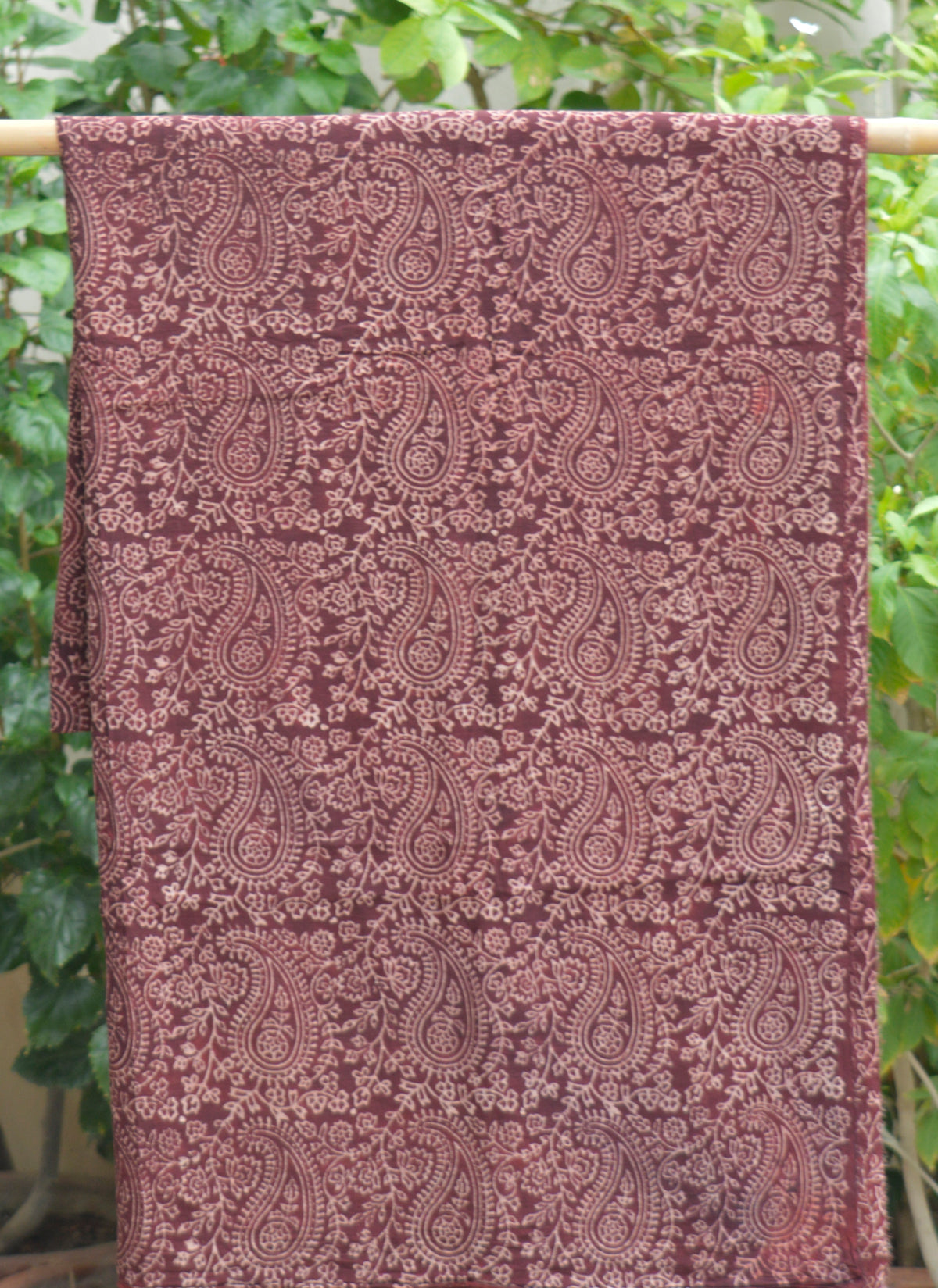 Hand block printed Anbi Jaal Ajrak lawn fabric in maroon color for women's wear