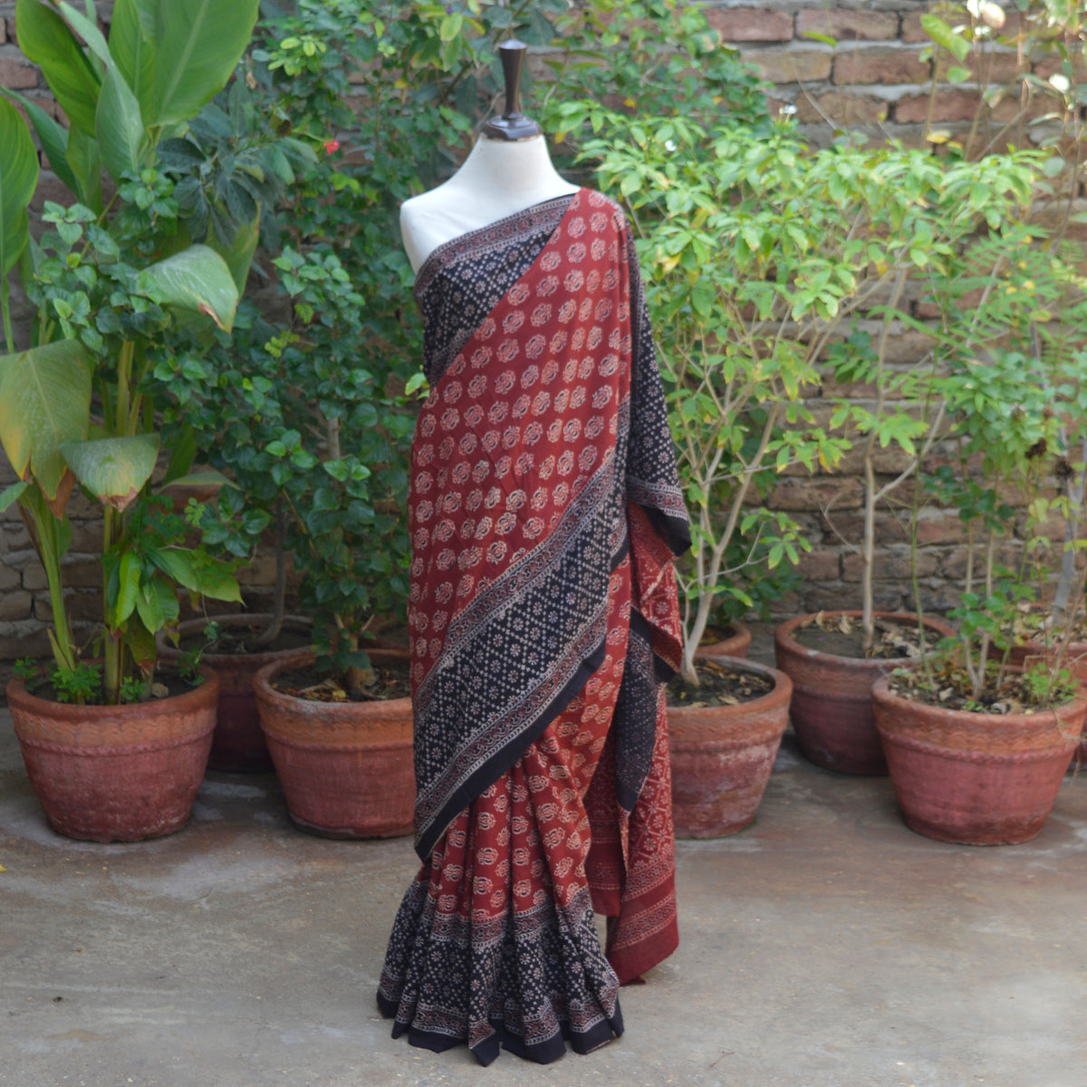 Traditional red and black Ajrak saree with matching blouse piece