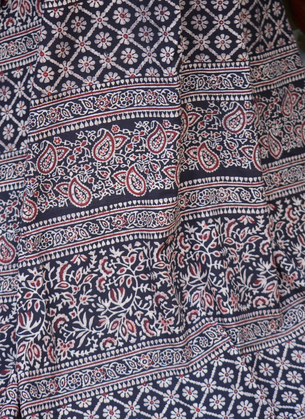 Traditional Ajrak saree in floral contrast design, 7 m cotton fabric with blouse included.
