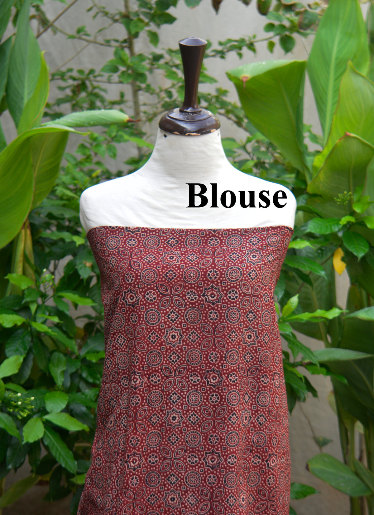 Matching red Ajrak saree blouse in organic dye block print design.