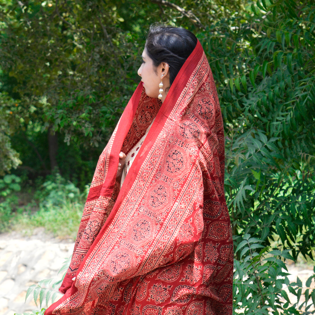 Traditional Ajrak chaadar in red, featuring detailed block printing and natural dye work