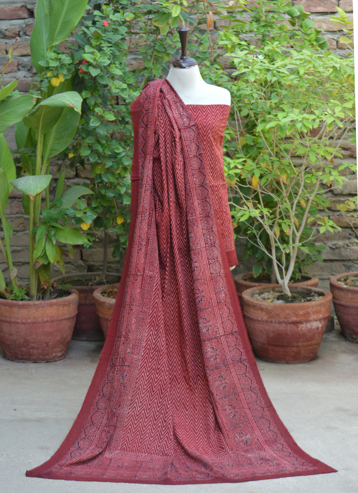 Unstitched red Ajrak lawn two-piece featuring authentic natural dye craftsmanship and hand block printed zigzag motifs