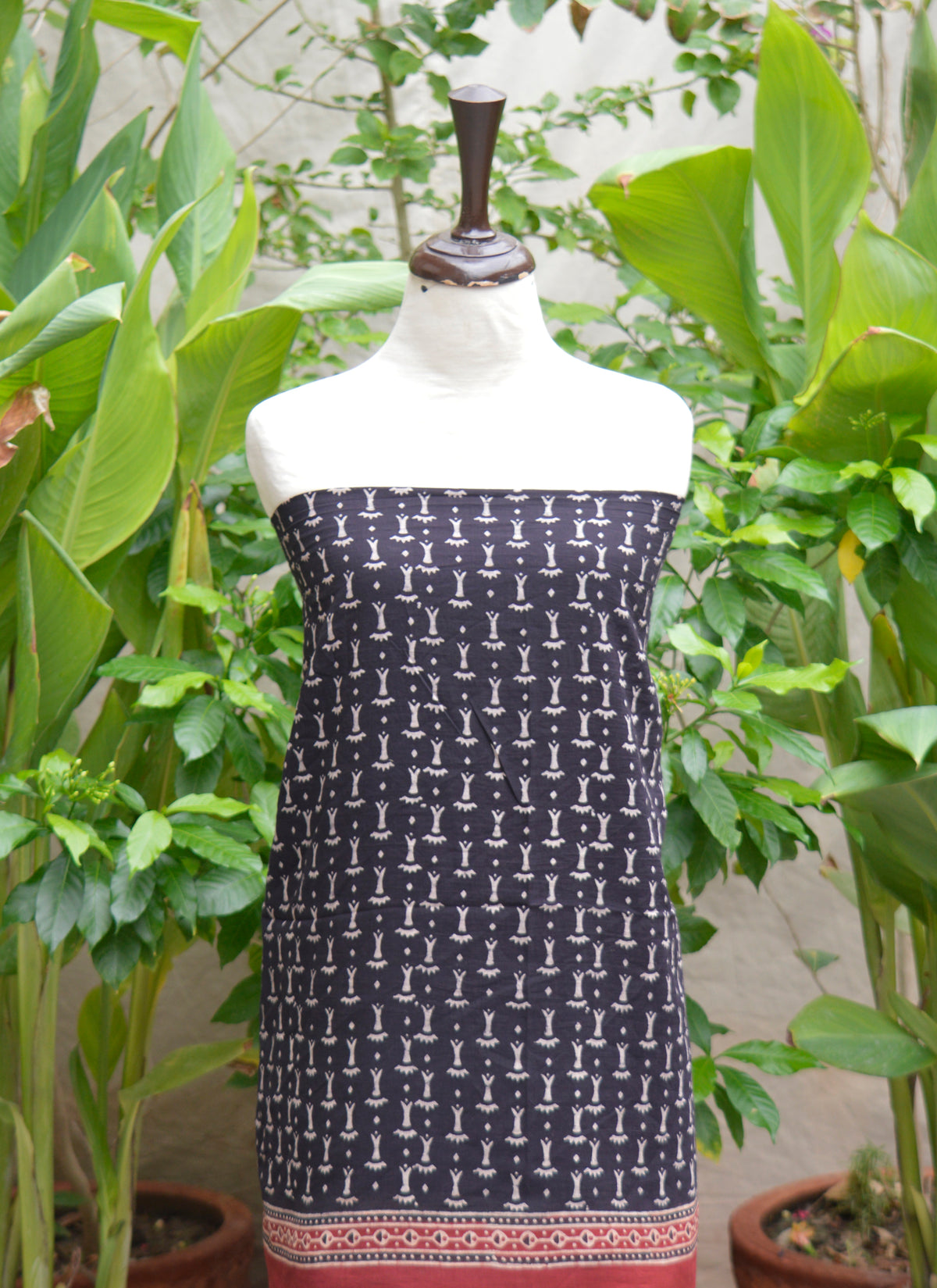 Traditional Ajrak two-piece outfit with organic dye block printing, artisan-made in black and bone tones