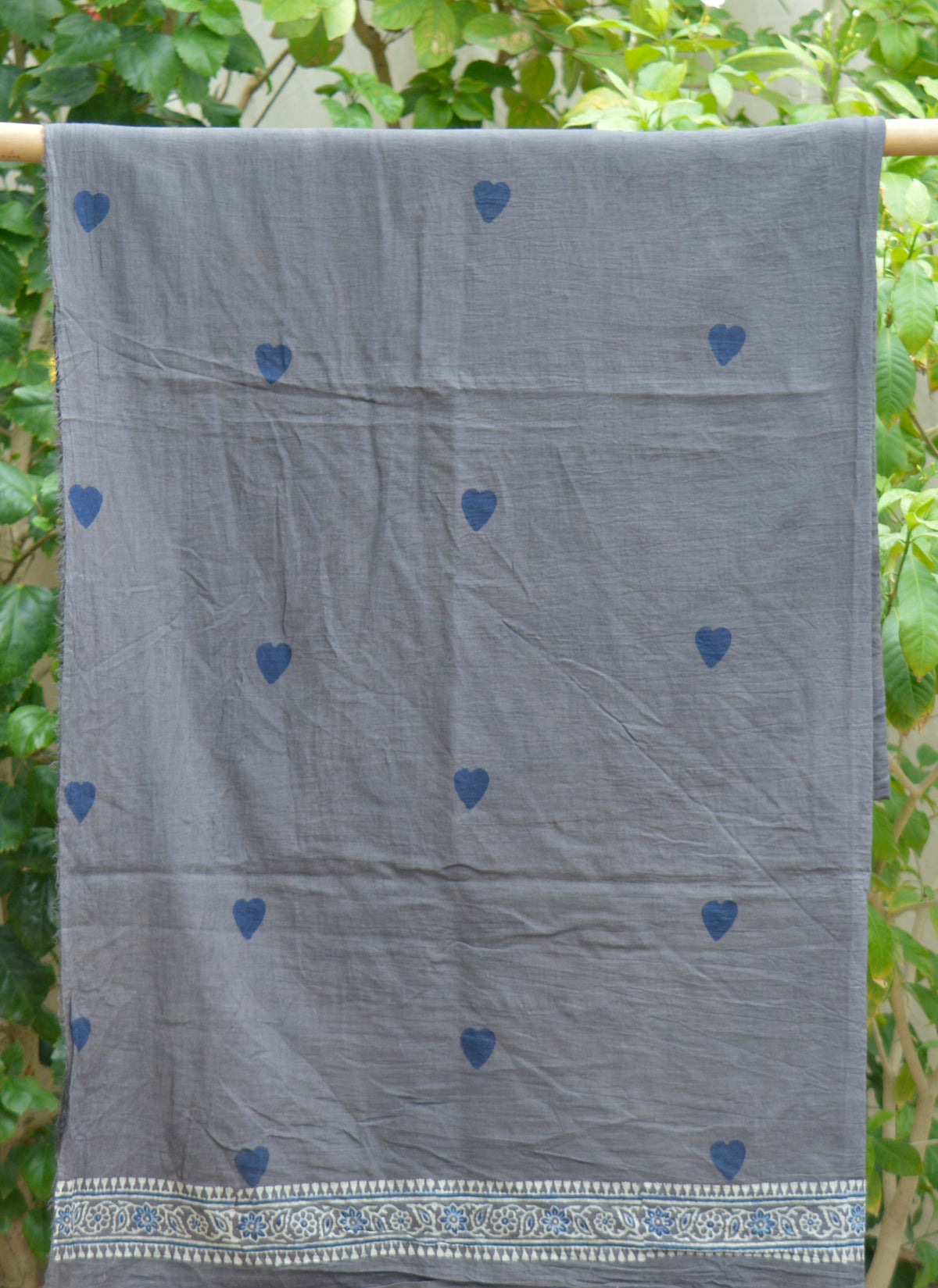 Charcoal grey Ajrak lawn fabric with blue heart motifs and hand block printed design