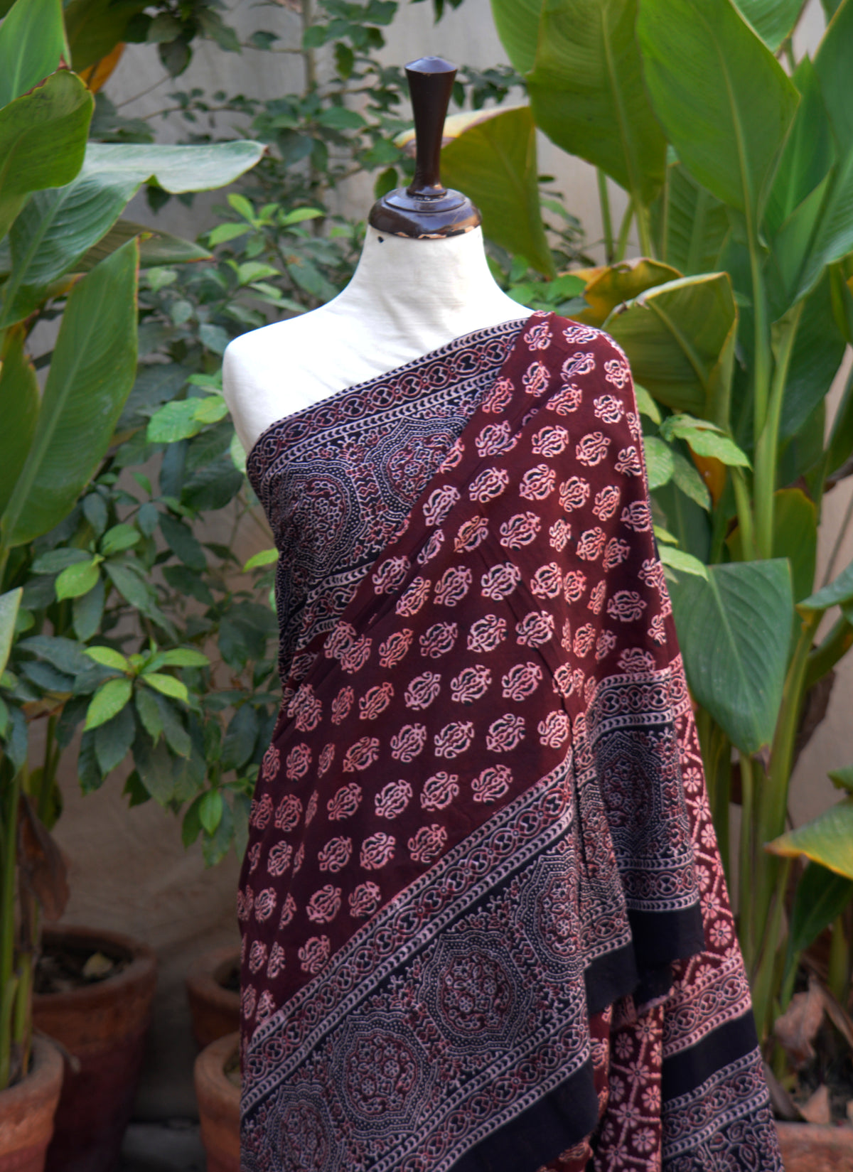 Ajrak saree maroon floral design handcrafted using natural dyes and wooden block printing