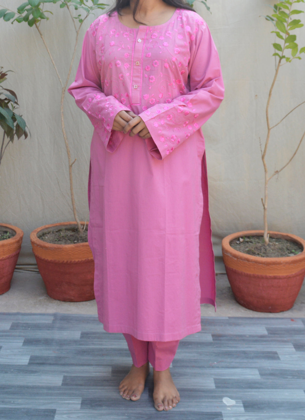 Hand embroidered pink cotton two-piece dress with traditional floral designs – Pakistani women’s wear