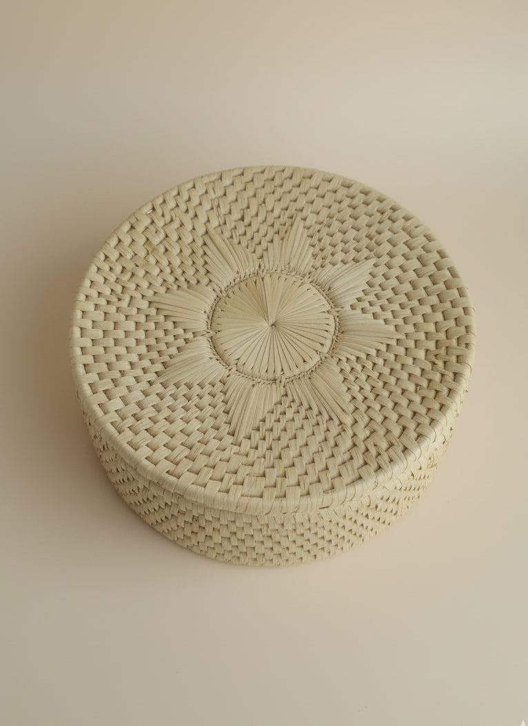 Beige palm leaf bread basket with flower design handmade by Sindhi women artisans sustainable décor