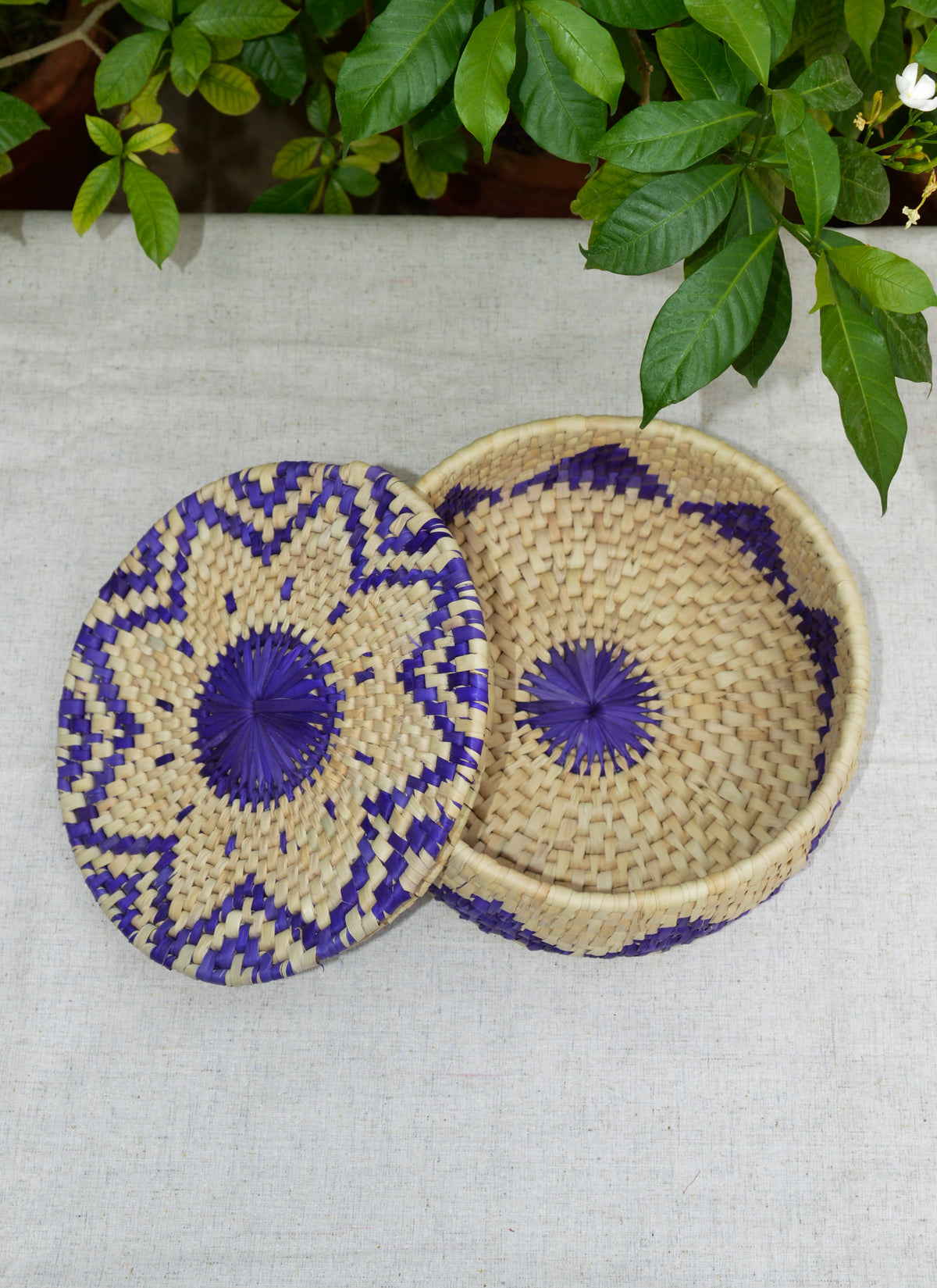Traditional woven bread basket crafted from palm leaves for dining table décor