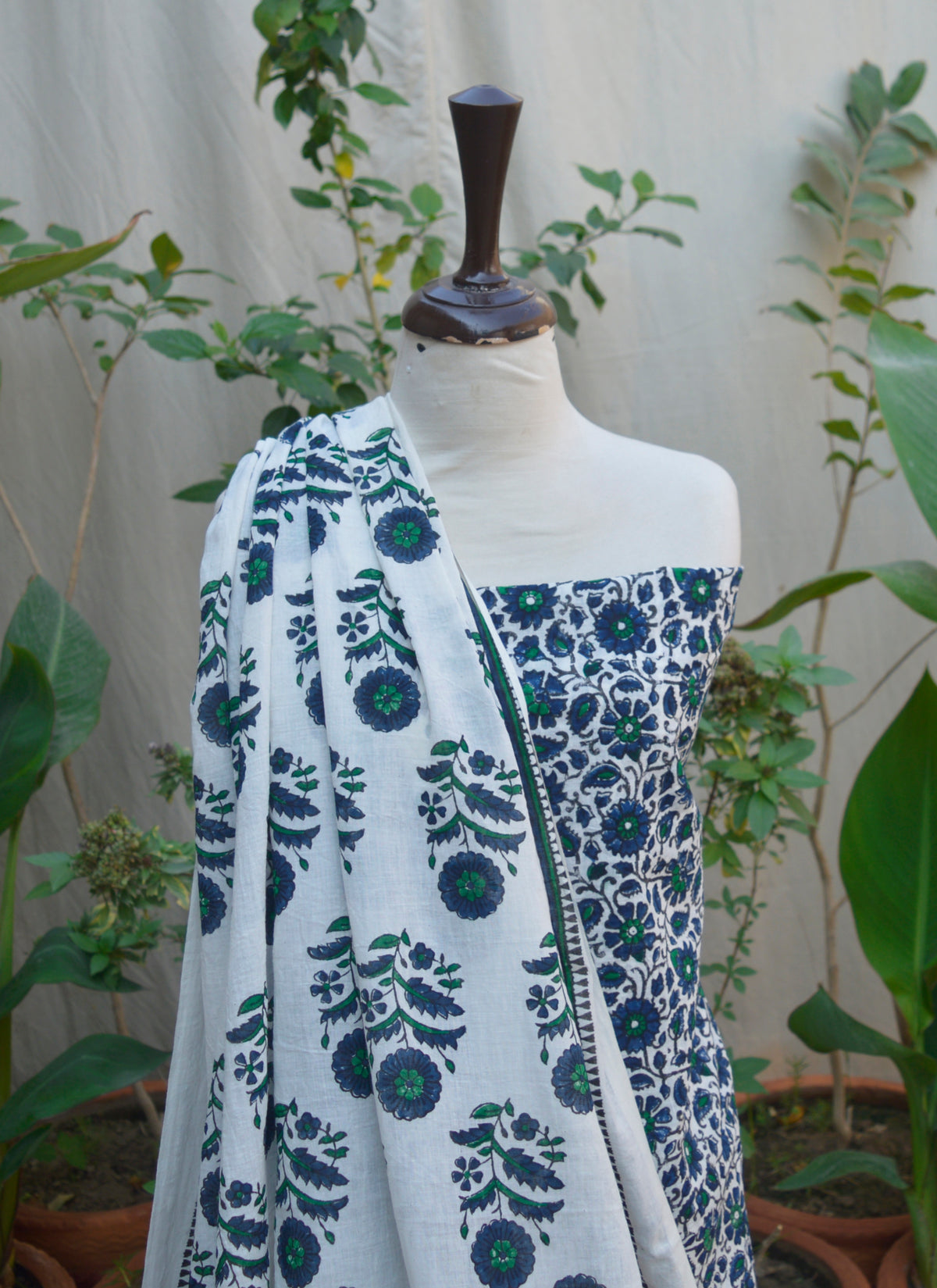 Close-up of Blue Daisy Flower Hand Block Print on Soft White Lawn Fabric – Traditional Craftsmanship.