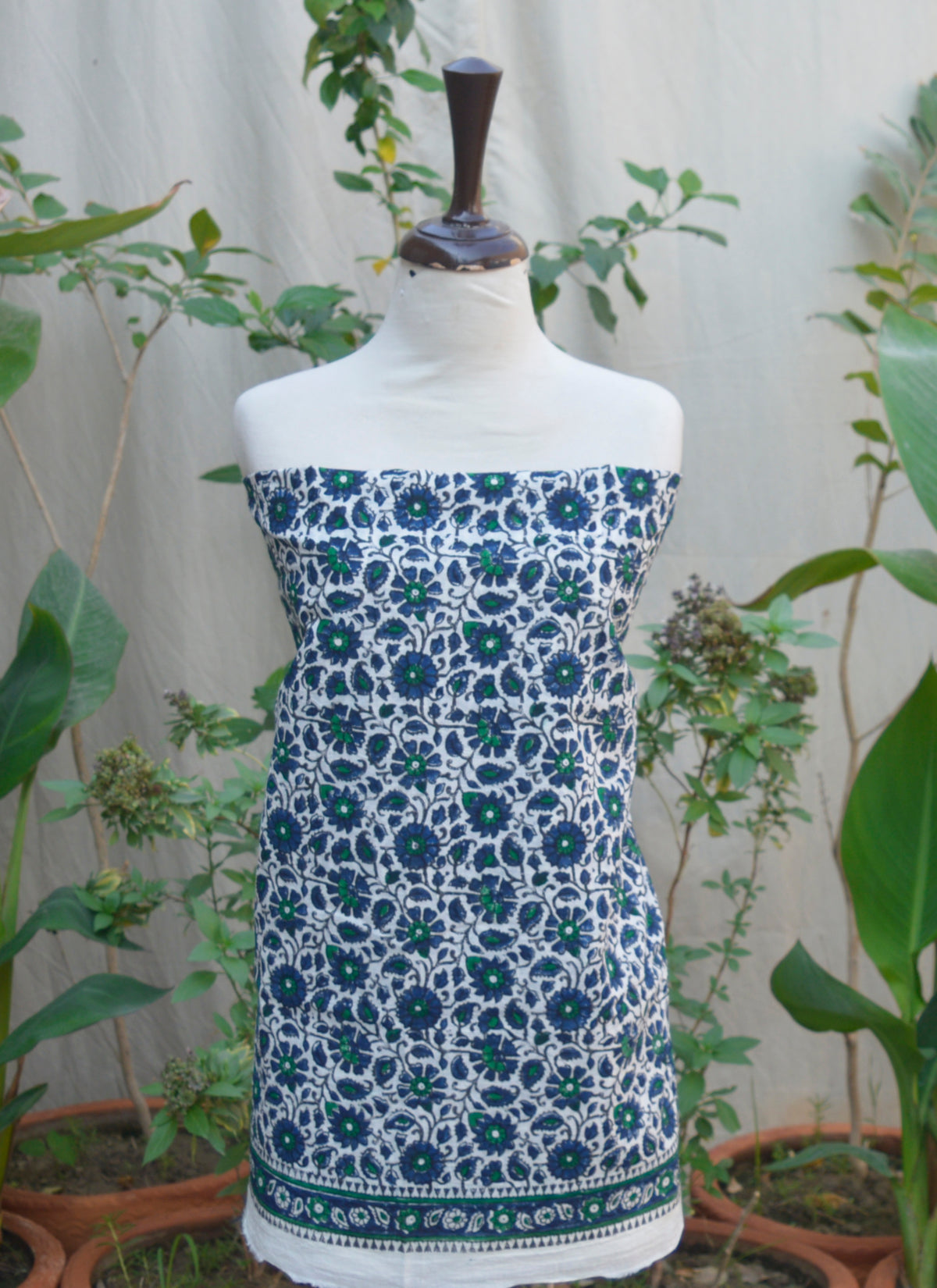Elegant Unstitched Lawn Two-Piece Set with Delicate Hand Block Printed Floral Motifs and Lightweight Dupatta.