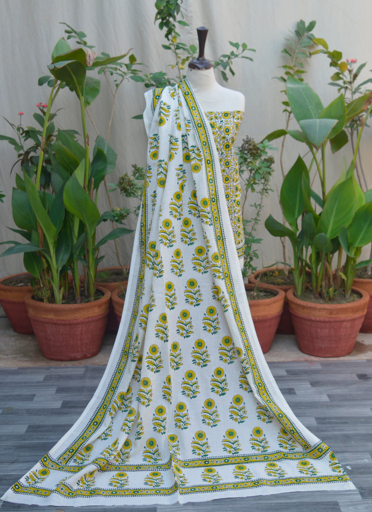 Yellow hand block printed dress featuring daisy flower motifs on soft lawn fabric