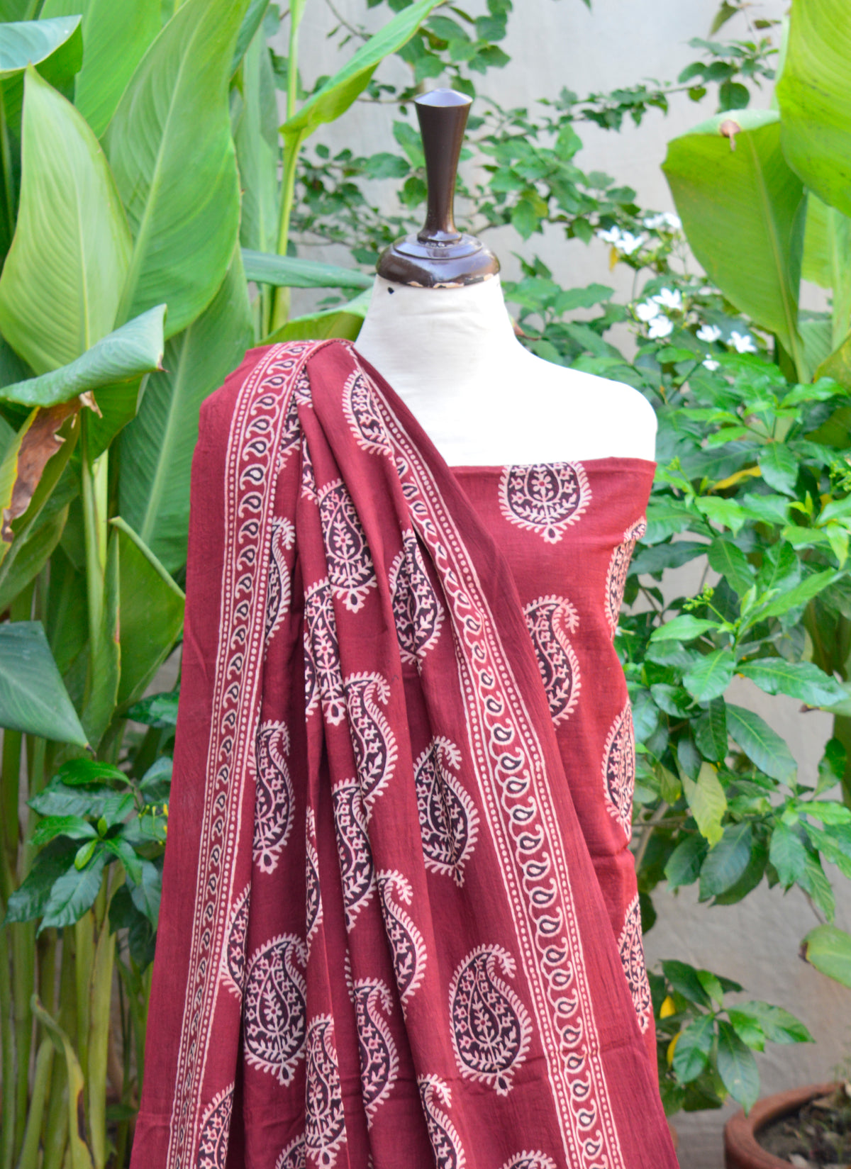Premium lawn cotton fabric with Ajrak Anbi print in red, block printed and unstitched.
