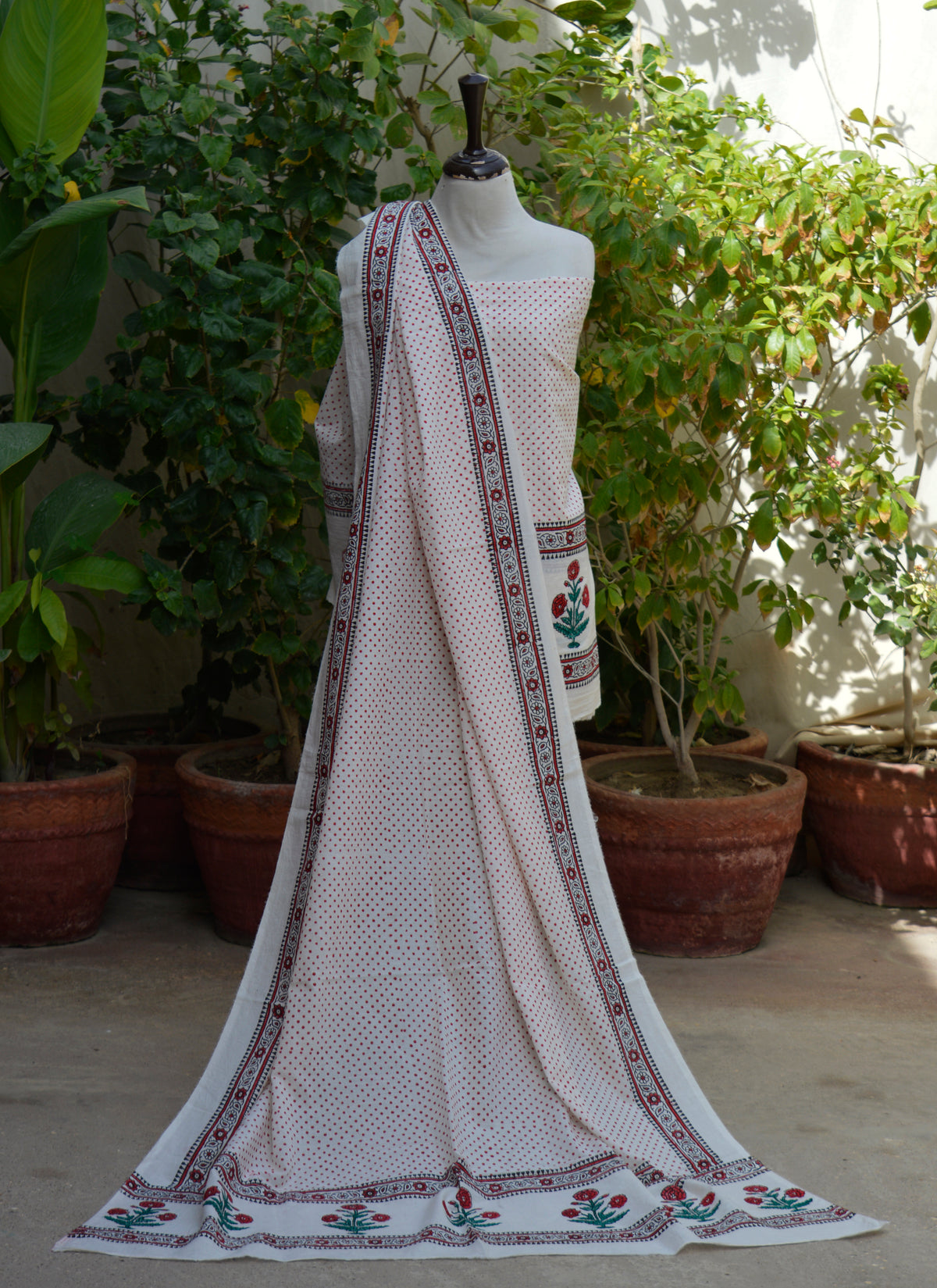 Premium cotton unstitched two-piece dress featuring hand block printed blood red dots and elegant floral butta border for summer wear