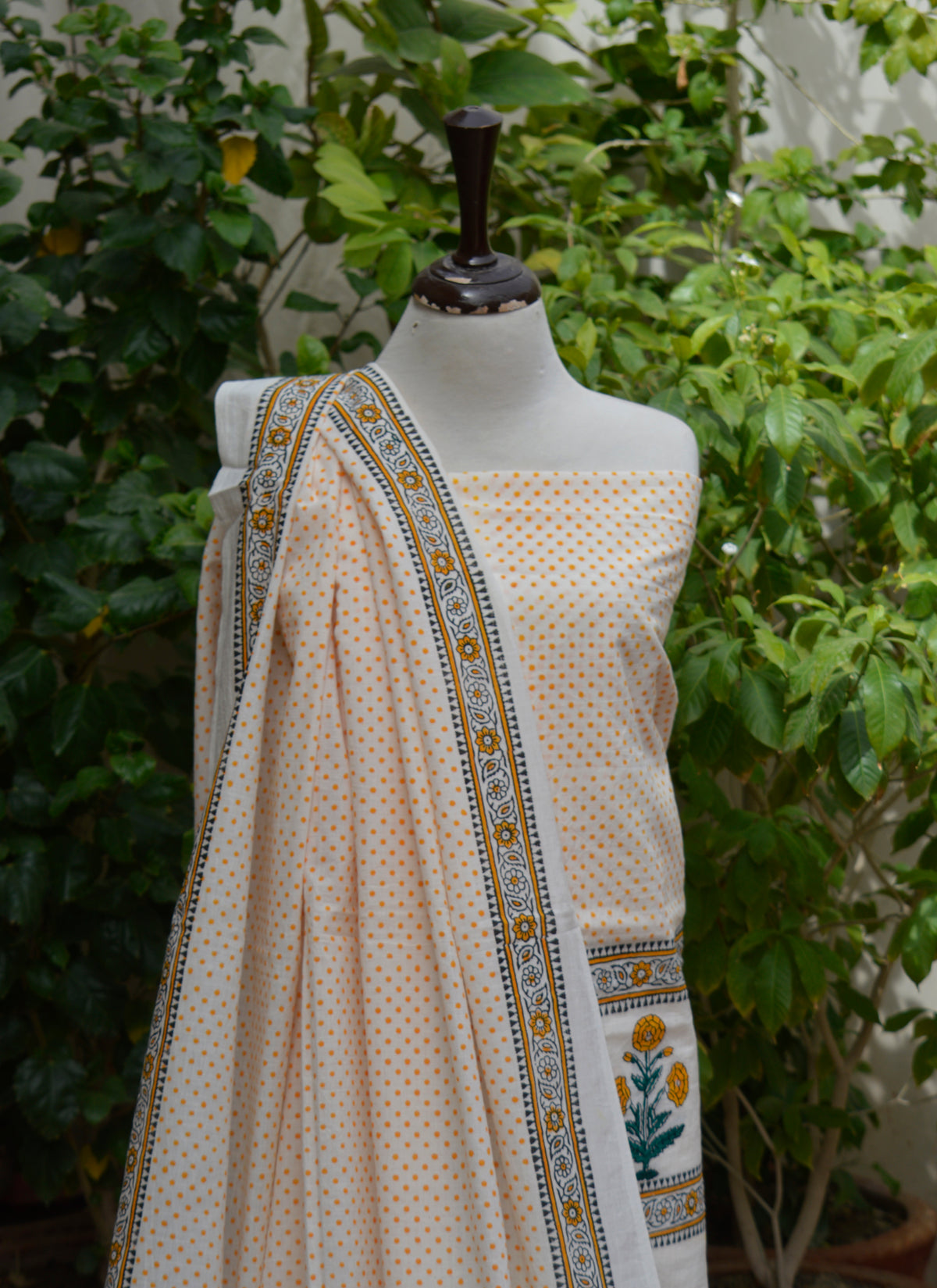 Unstitched cotton two-piece featuring golden yellow dot pattern and floral butta border print