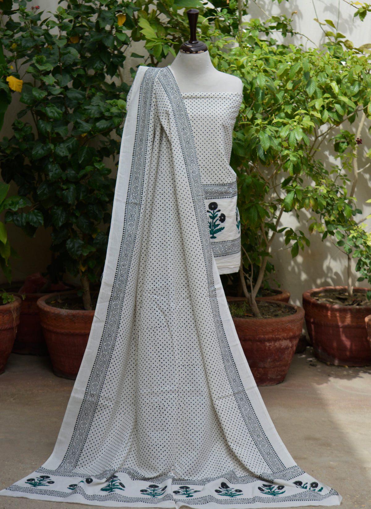 Artisan handcrafted cotton dress fabric with black dot print and floral butta border for women
