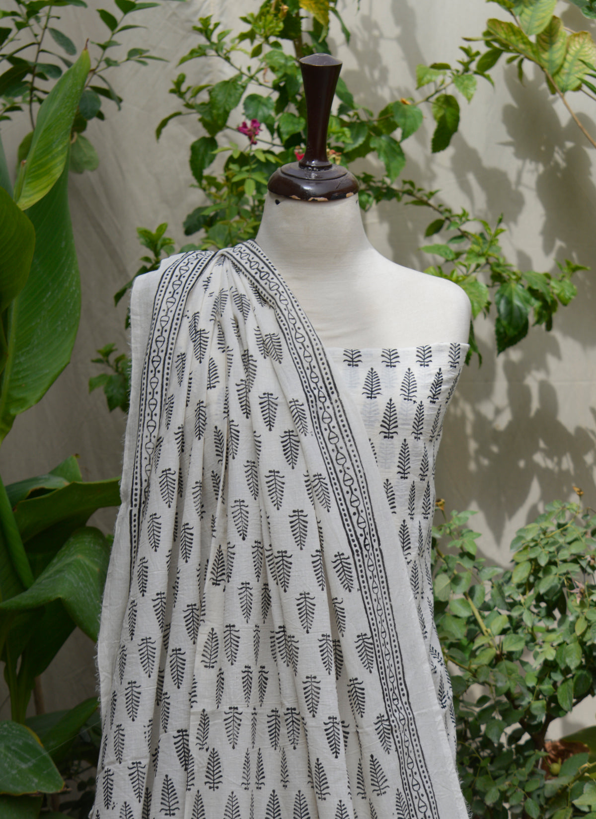 Two-piece lawn set featuring black shirt and dupatta with block-printed mountain motifs