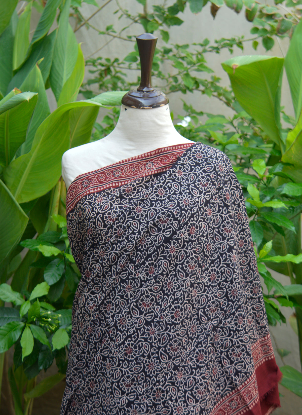 Organic dyed Ajrak floral contrast saree, unstitched premium cotton, includes blouse piece.