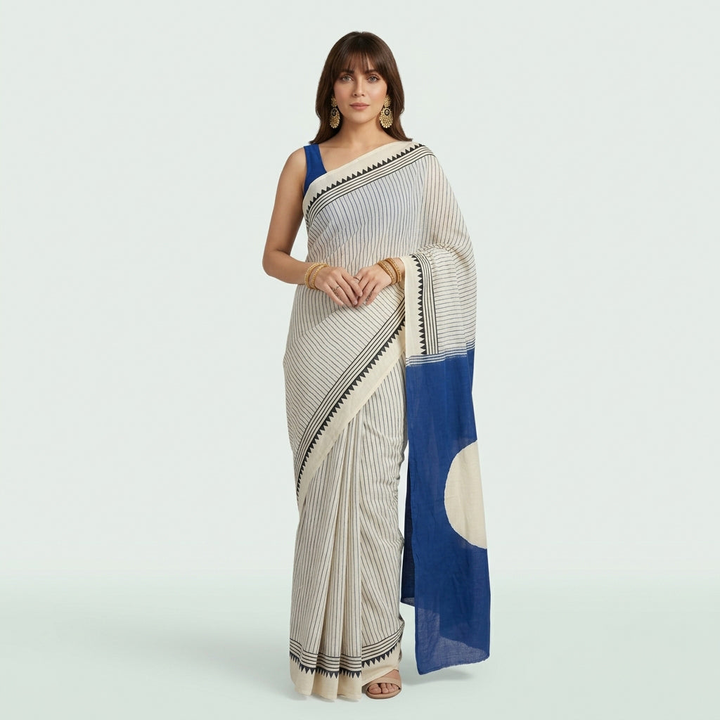 Kora Kinar blue saree with geometric borders and traditional hand block printed circular motifs.