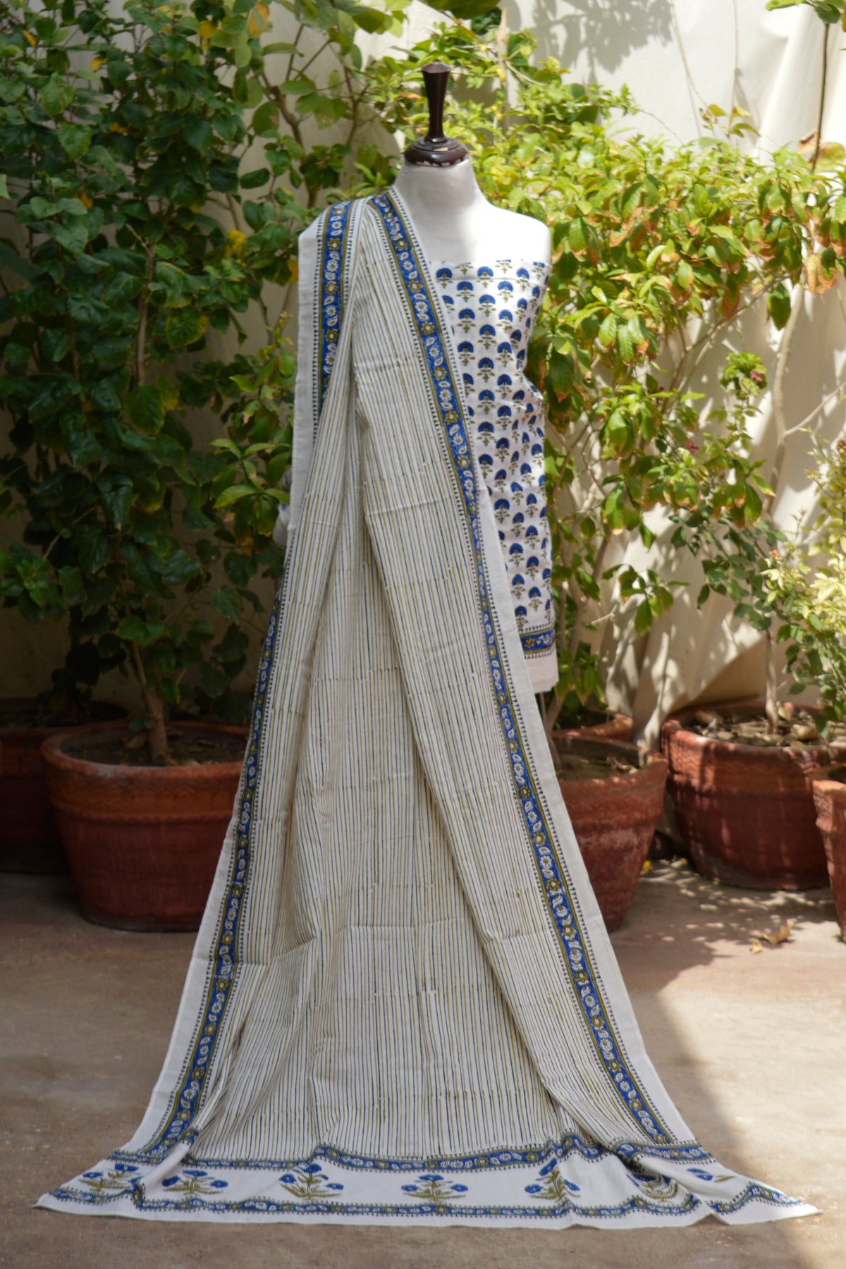 Unstitched cotton summer wear featuring floral shirt striped dupatta and matching trouser