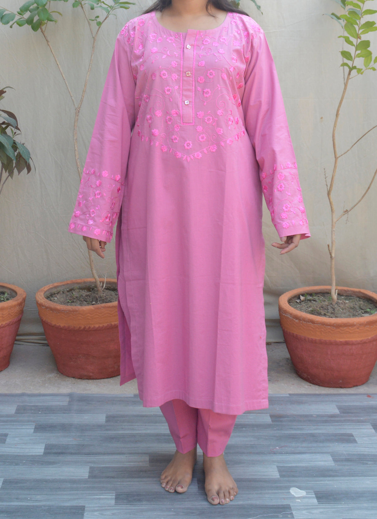 Traditional hand embroidery on pastel pink cotton fabric – elegant and comfortable two-piece dress for women