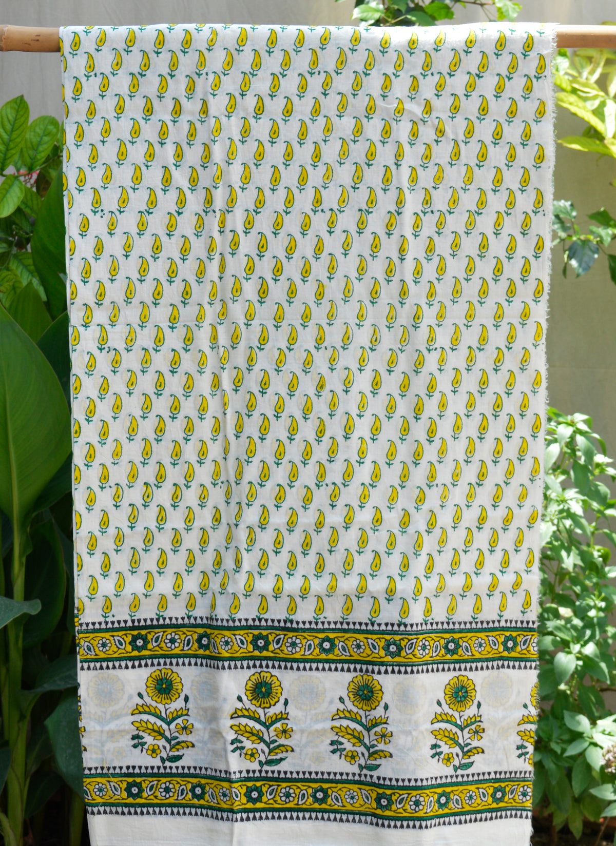 Hand block printed yellow Kerry paisley design on unstitched lawn kurta fabric, 2.5 meters long.