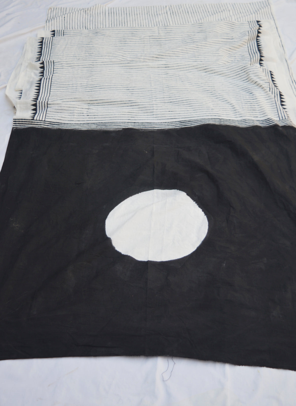Black cotton saree with circular motif and solid pallu hand block print