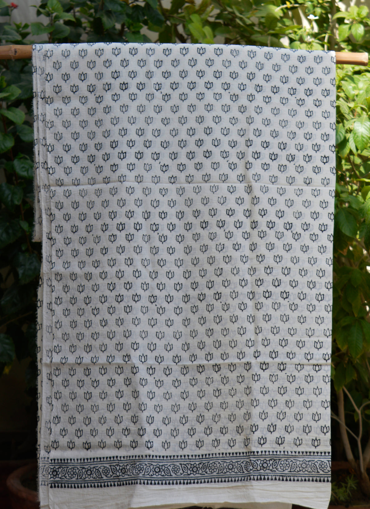 Hand block print lotus tiny motifs cotton fabric with black floral print on white base