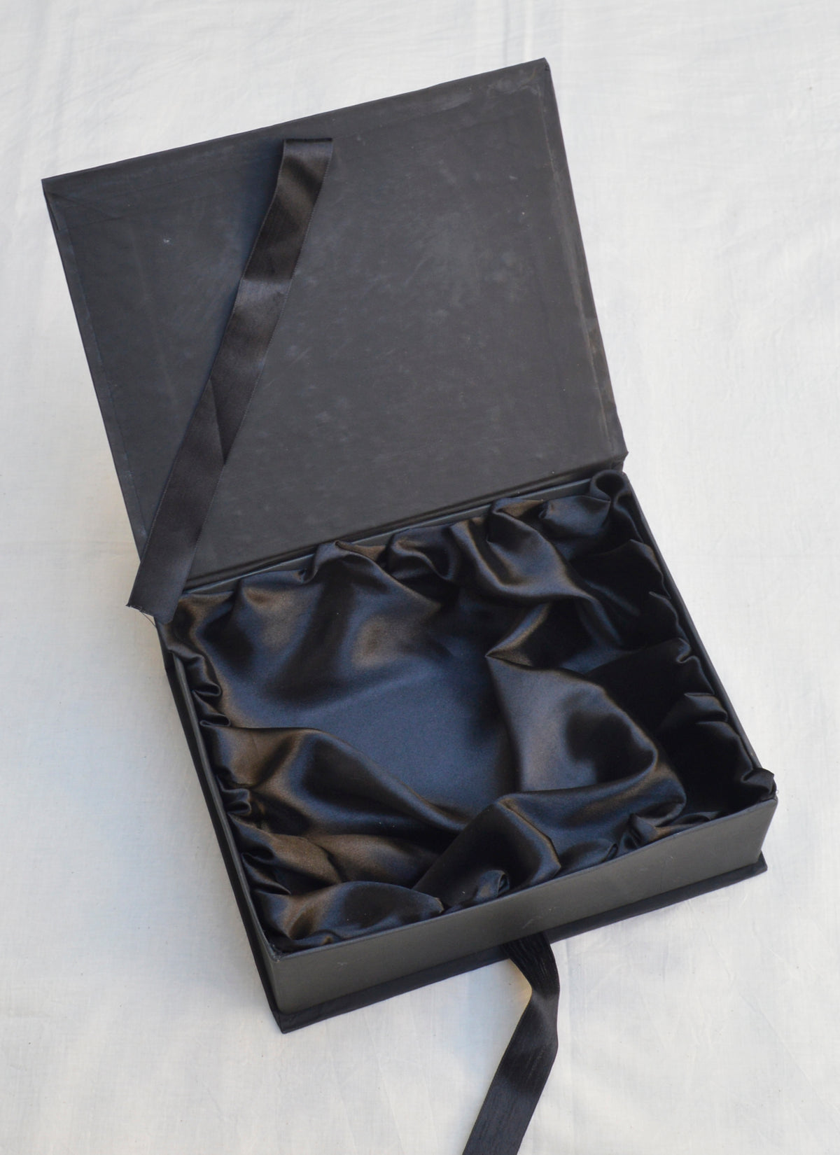 Luxury black satin gift box with elegant soft lining, perfect for premium gift packaging.