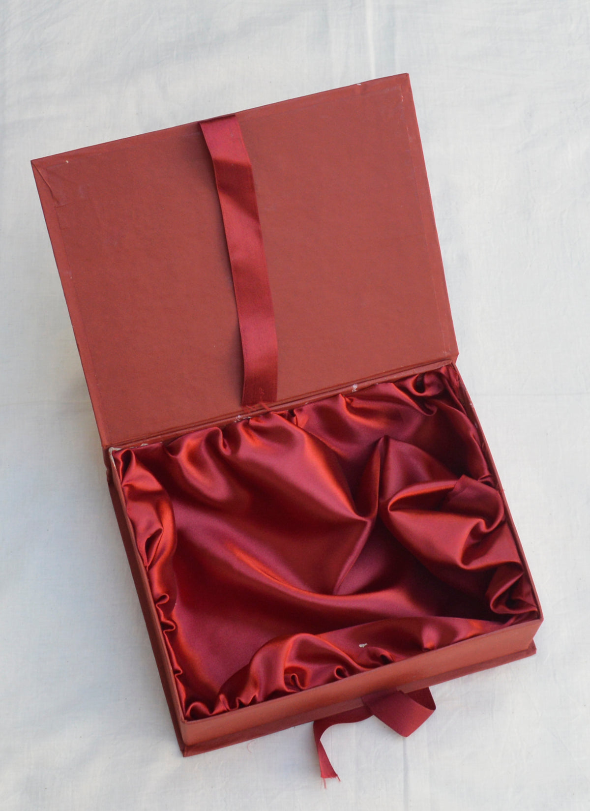Luxury maroon satin gift box with elegant satin lining for premium gifting.