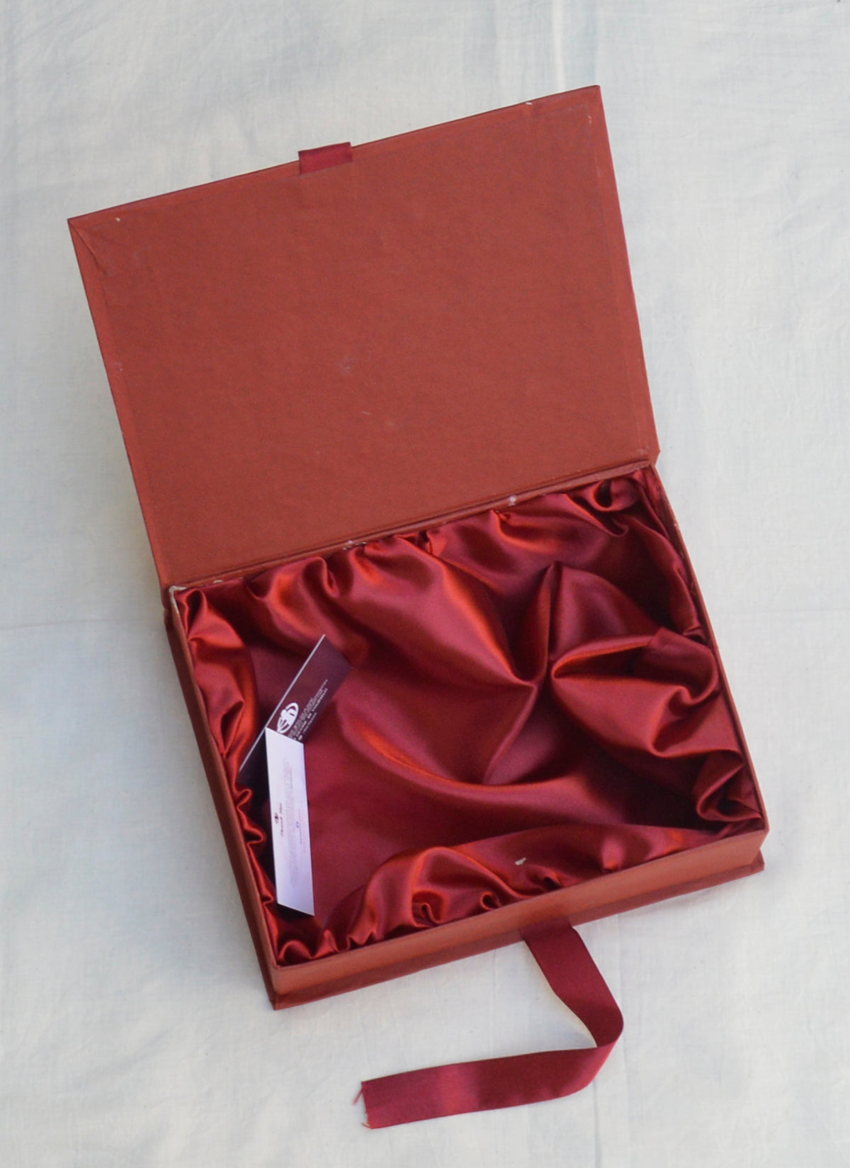 Premium maroon gift box with a soft satin interior, perfect for special occasions.