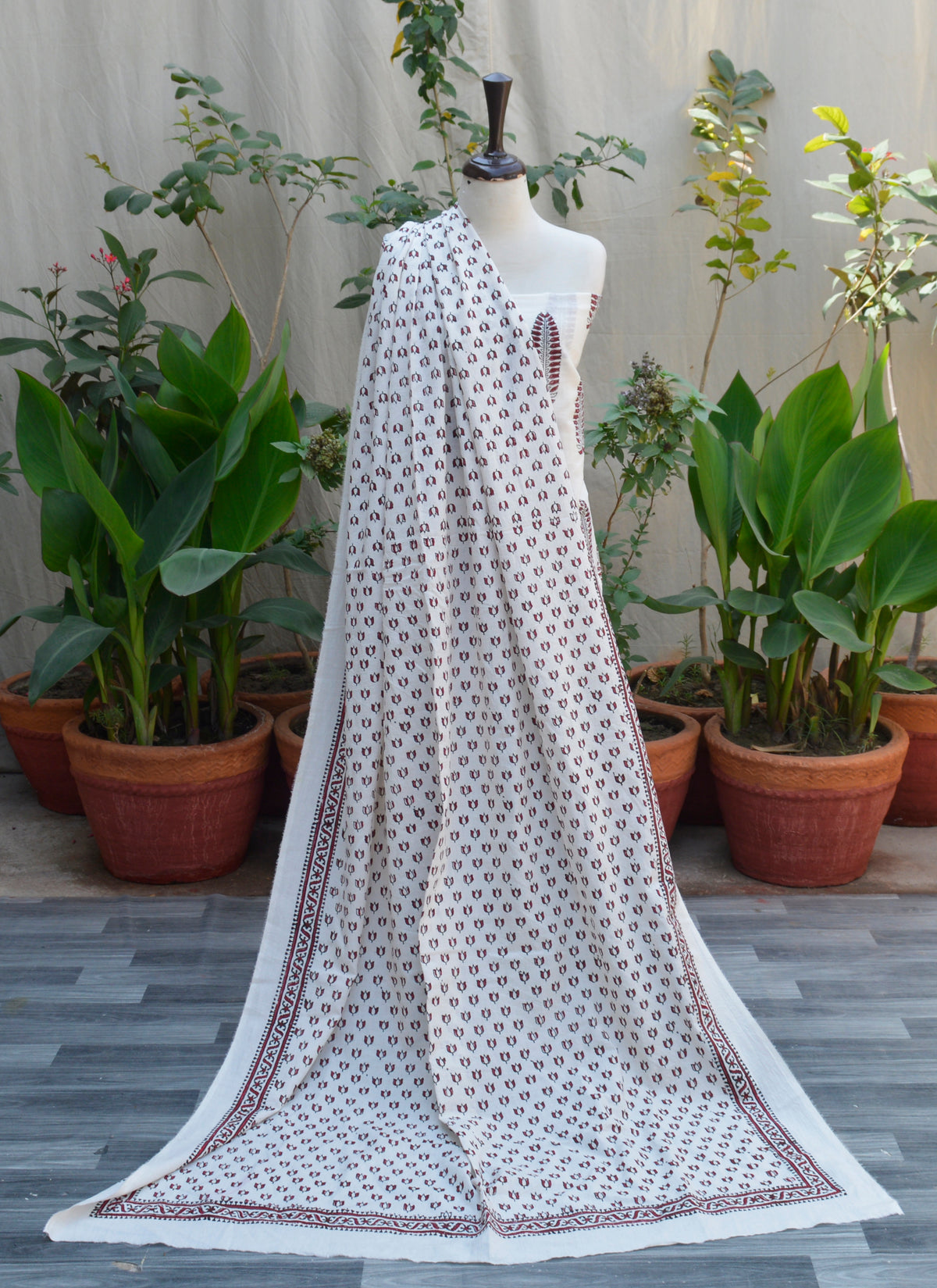 Hand block printed mountain butta and lotus motifs on maroon and white unstitched lawn two-piece
