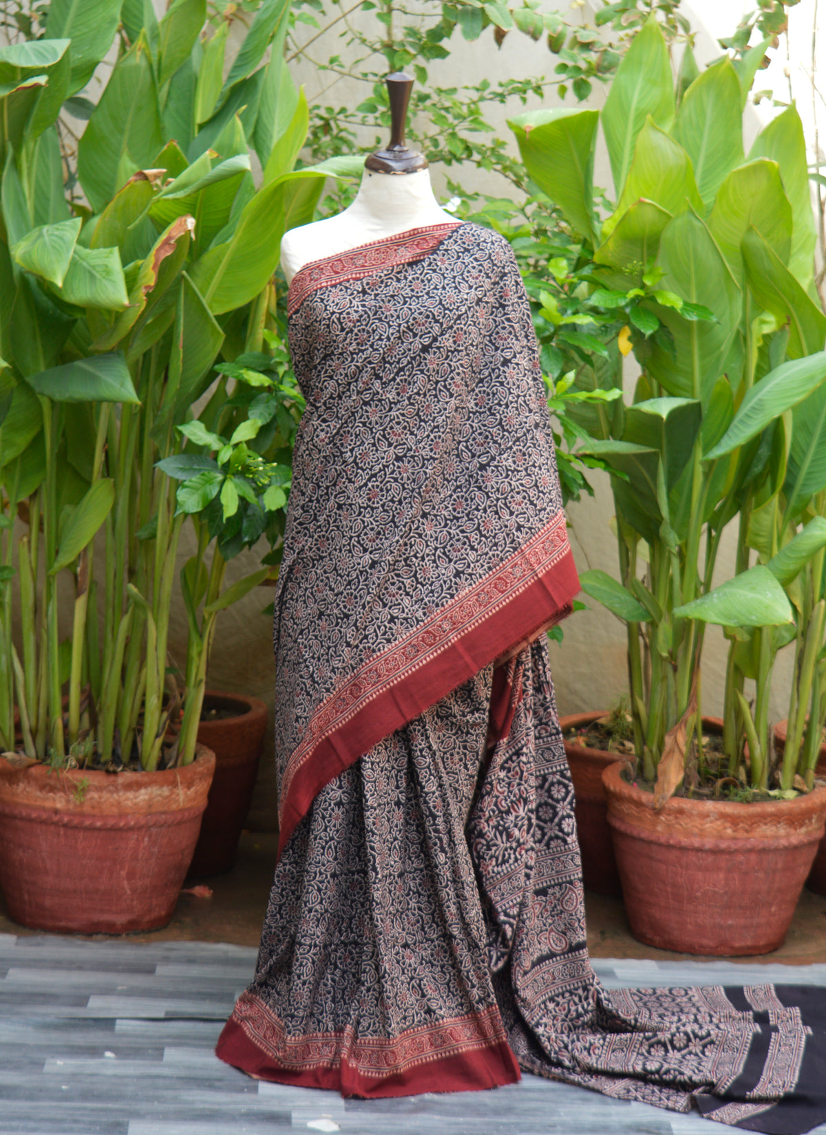 Hand block-printed Ajrak saree with floral contrast pattern on premium cotton with matching blouse.
