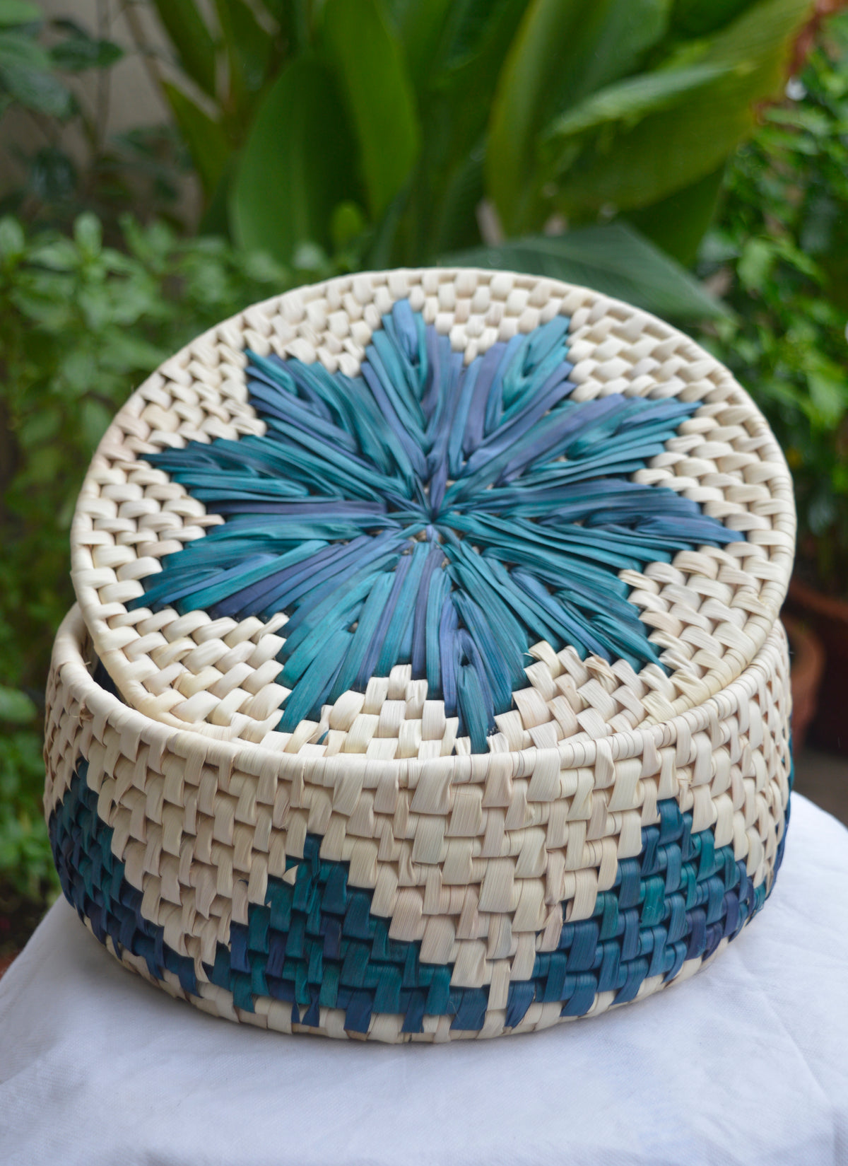Hand woven palm leaf bread basket in ferozi color, eco-friendly roti dan from Sindh.