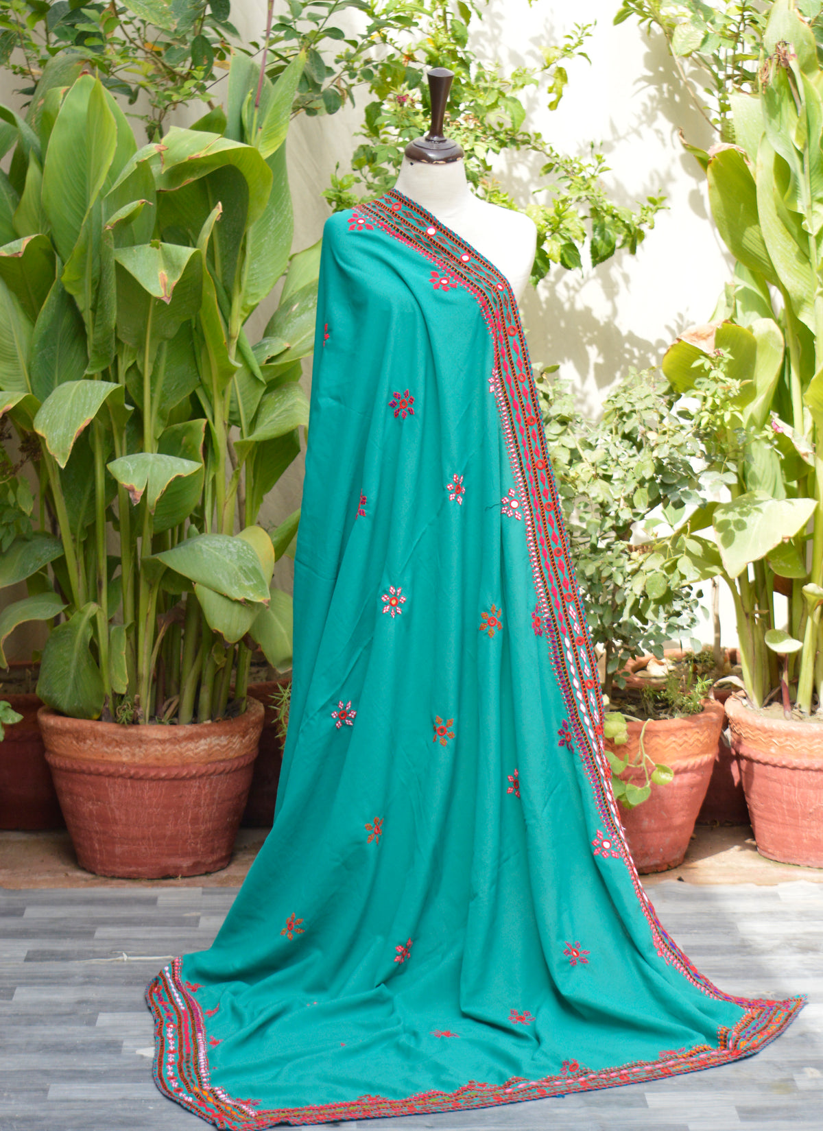Dmmy draped in handmade sea green chadar styled for festive or cultural event