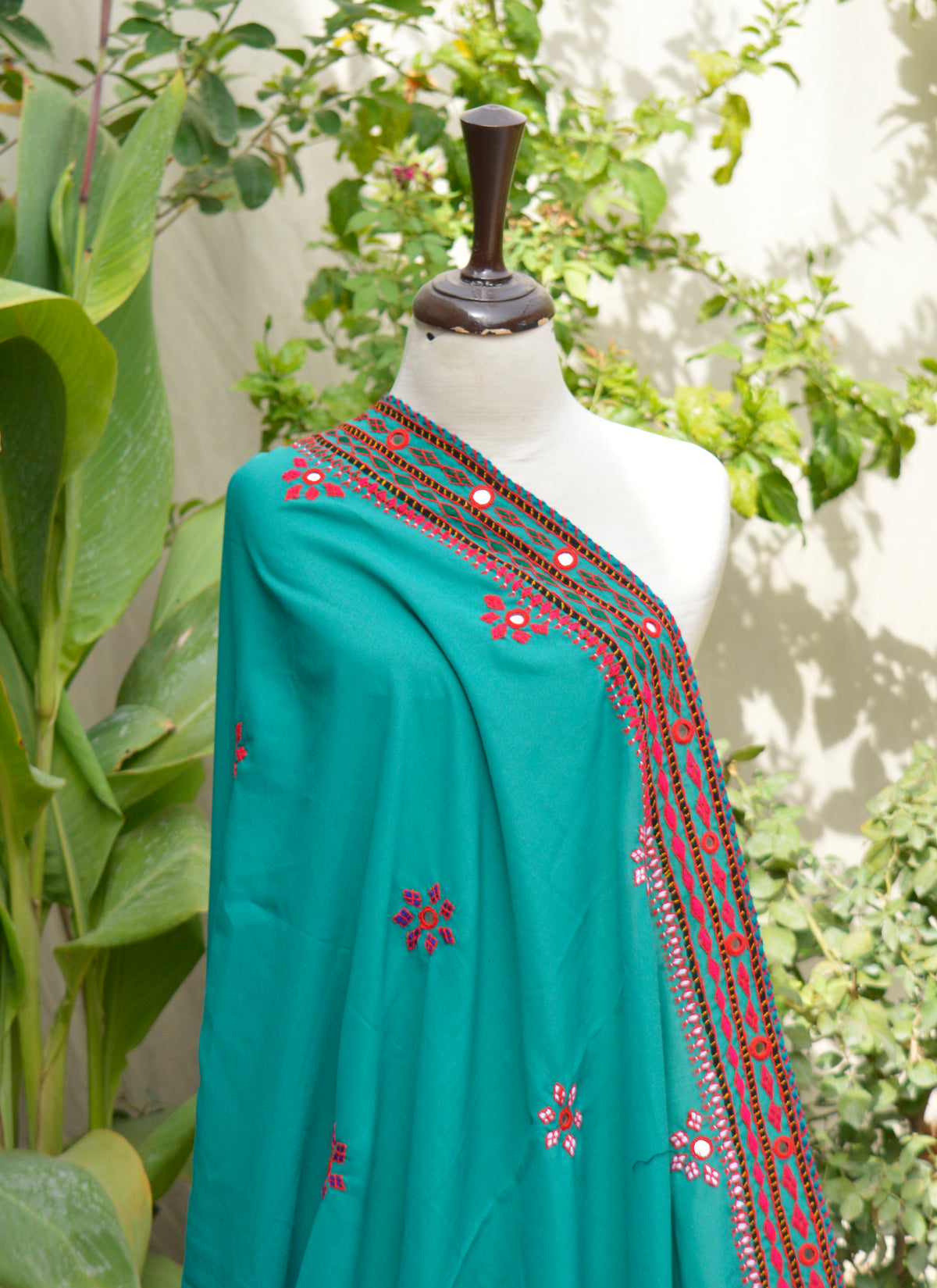 Close-up of multicolor thread and mirror embroidery on Swiss Voil chadar