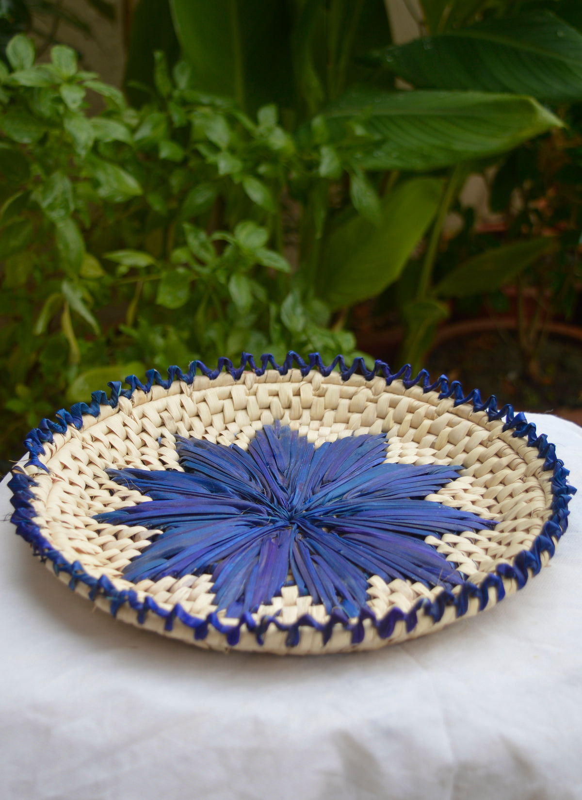 Eco-friendly palm leaf bread plate changair, handmade in purplish blue.
